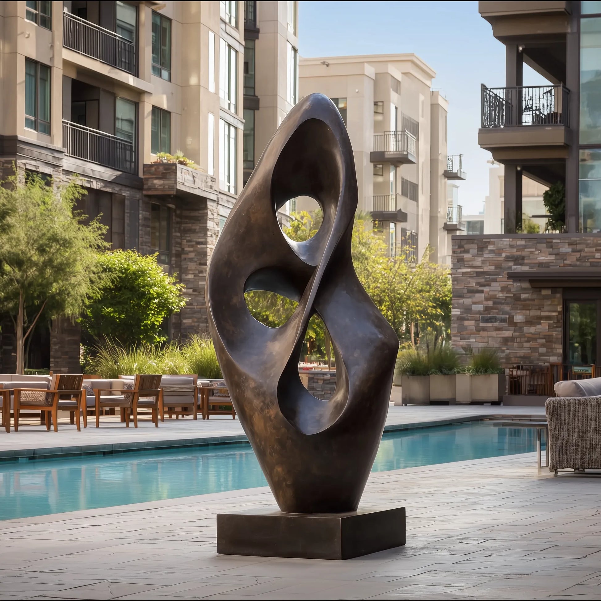 Abstract sculpture in bronze with modern design for poolside.