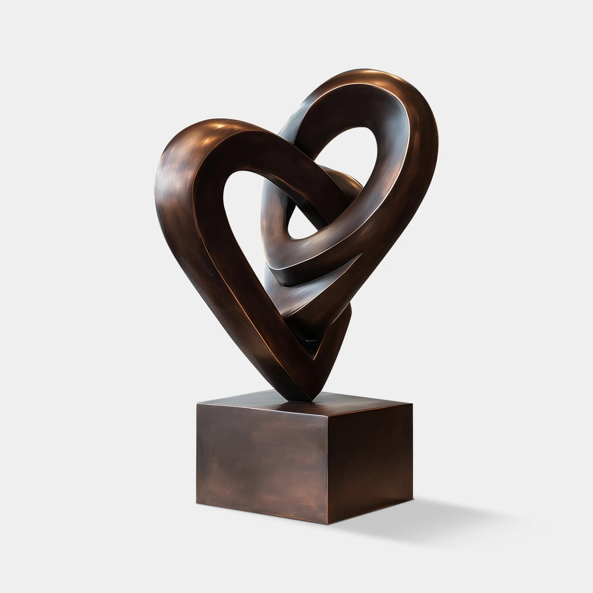 Abstract bronze heart sculpture in modern design for interior setting