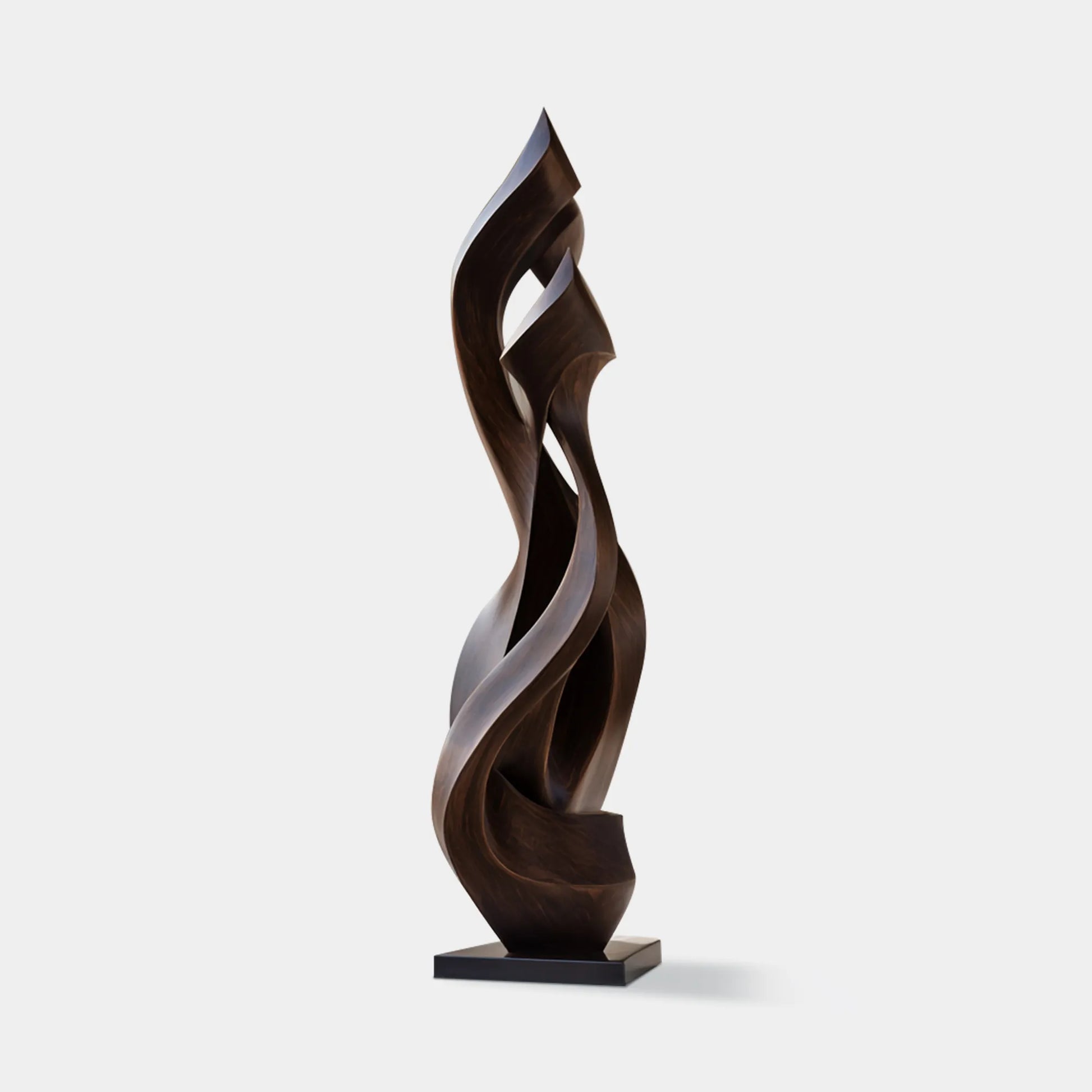Abstract bronze sculpture with flowing, wave-like curves for modern villa courtyards.