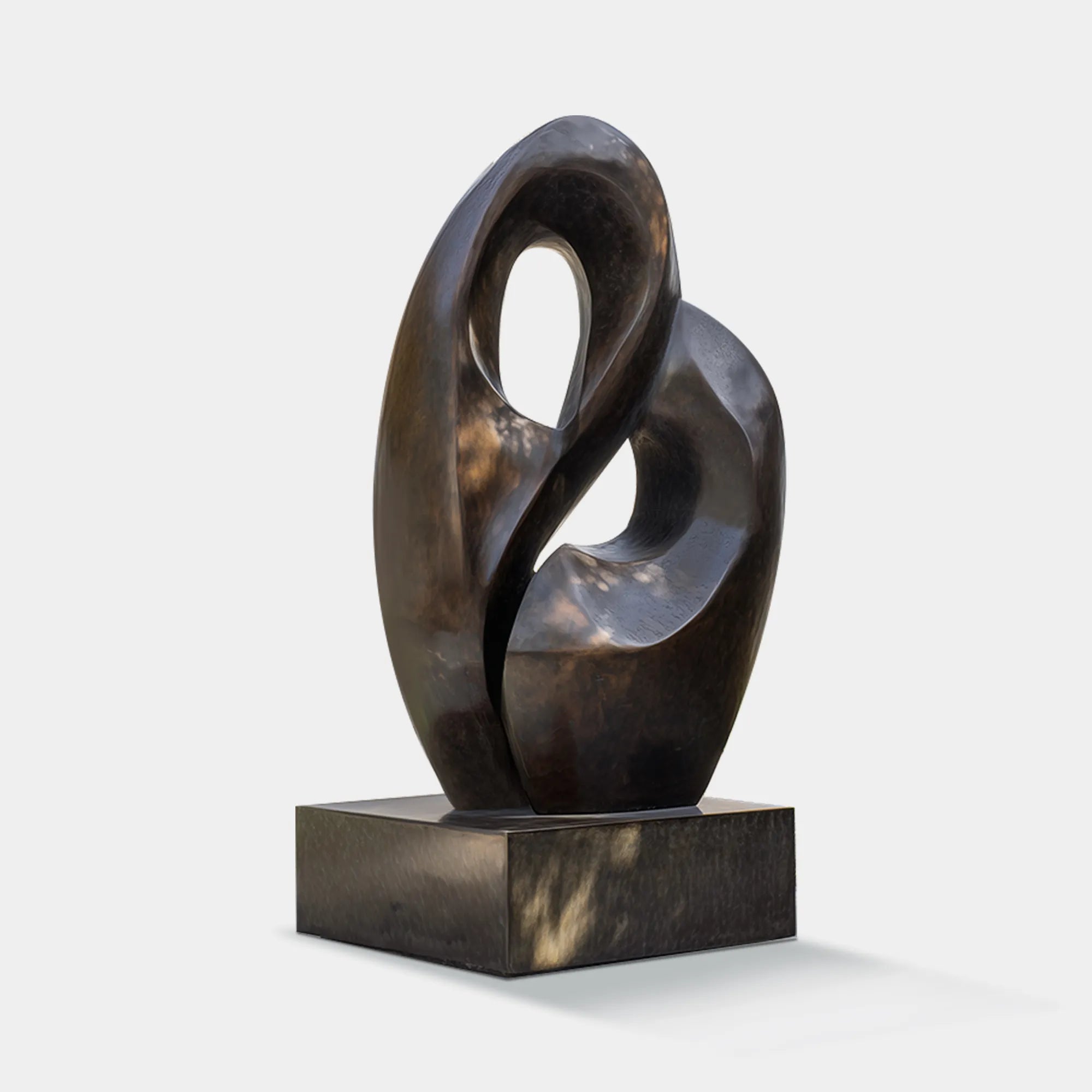 Abstract bronze sculpture with smooth, curved organic forms for outdoor spaces.