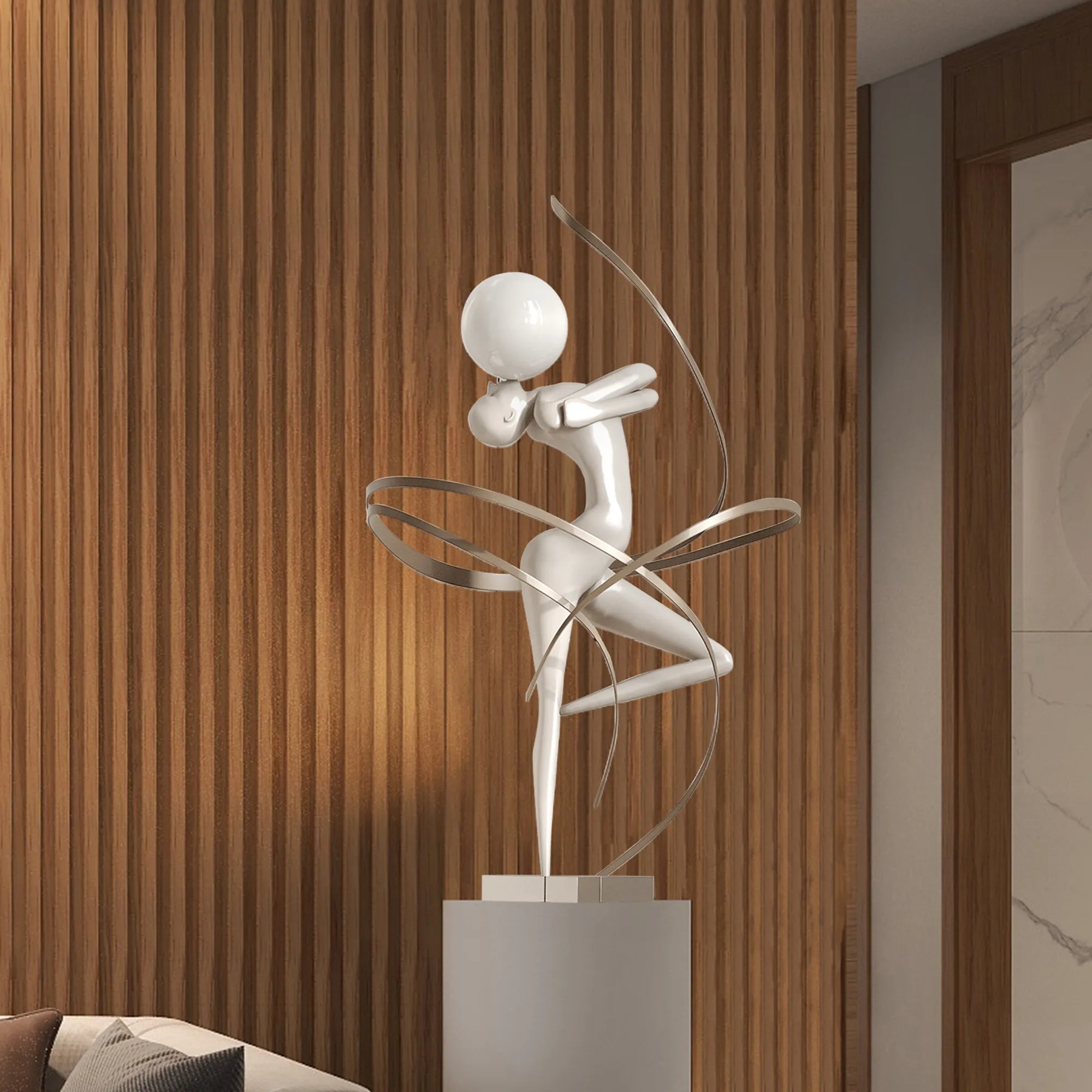 Modern fiberglass sculpture of a figure with ball and ribbons for interiors.