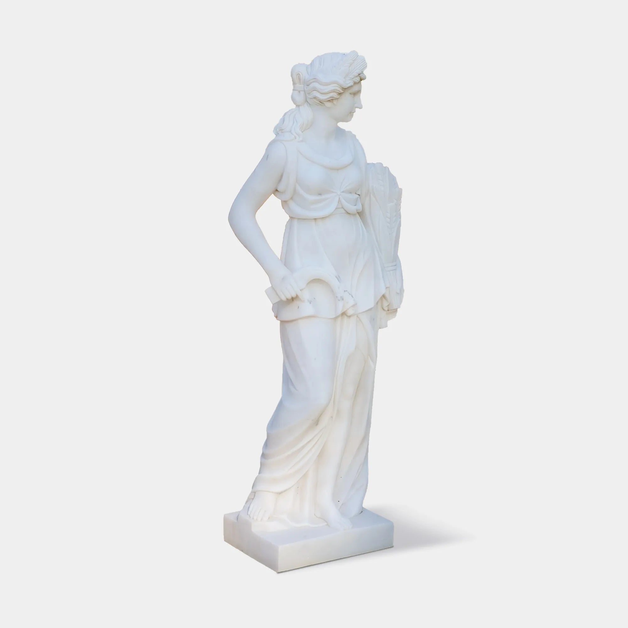 Marble sculpture of the Goddess of Harvest holding wheat, a symbol of abundance and fertility, ideal for garden settings.