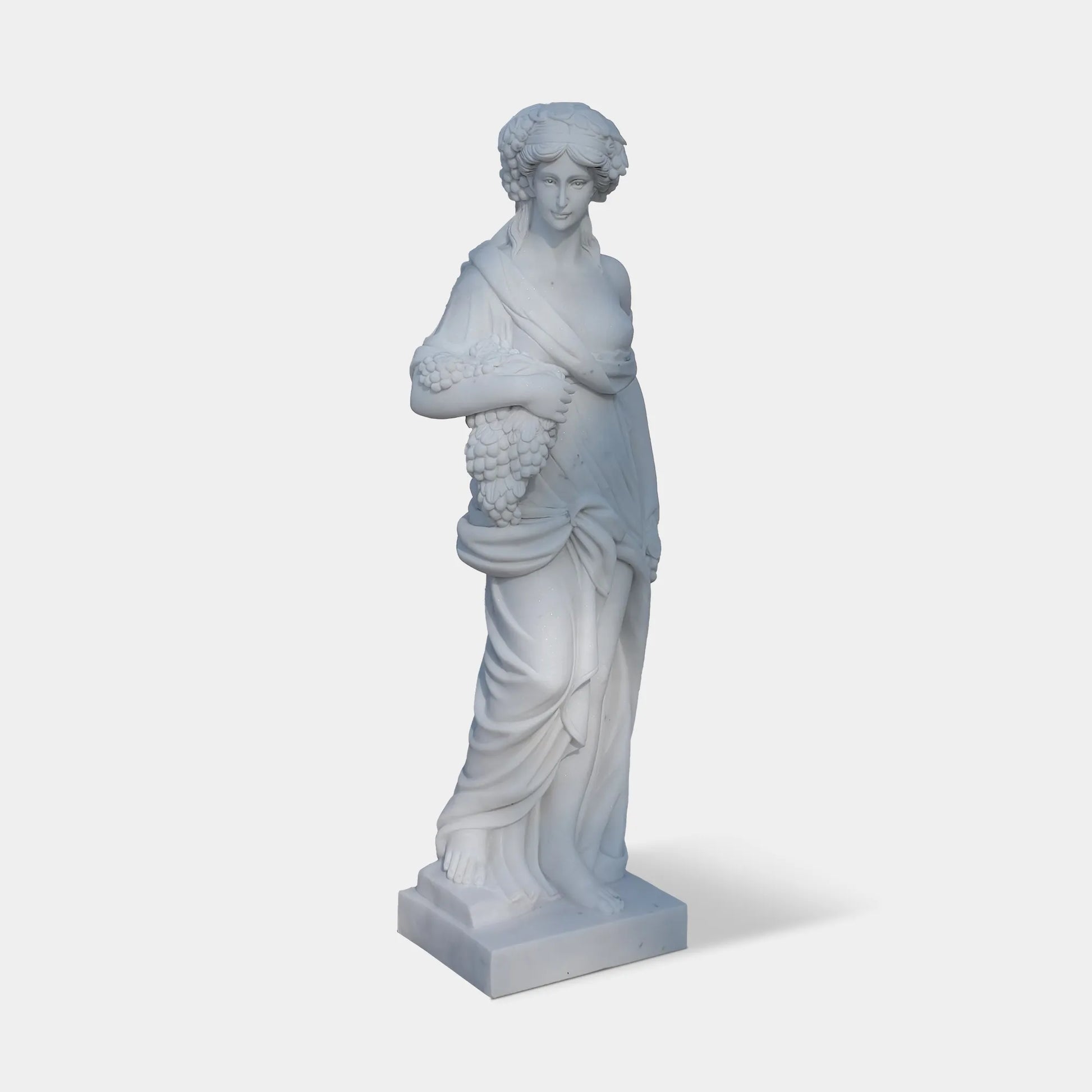 Marble sculpture of the Goddess of Abundance holding grapes, symbolizing fertility and prosperity, ideal for villa courtyards, gardens, and cultural spaces.