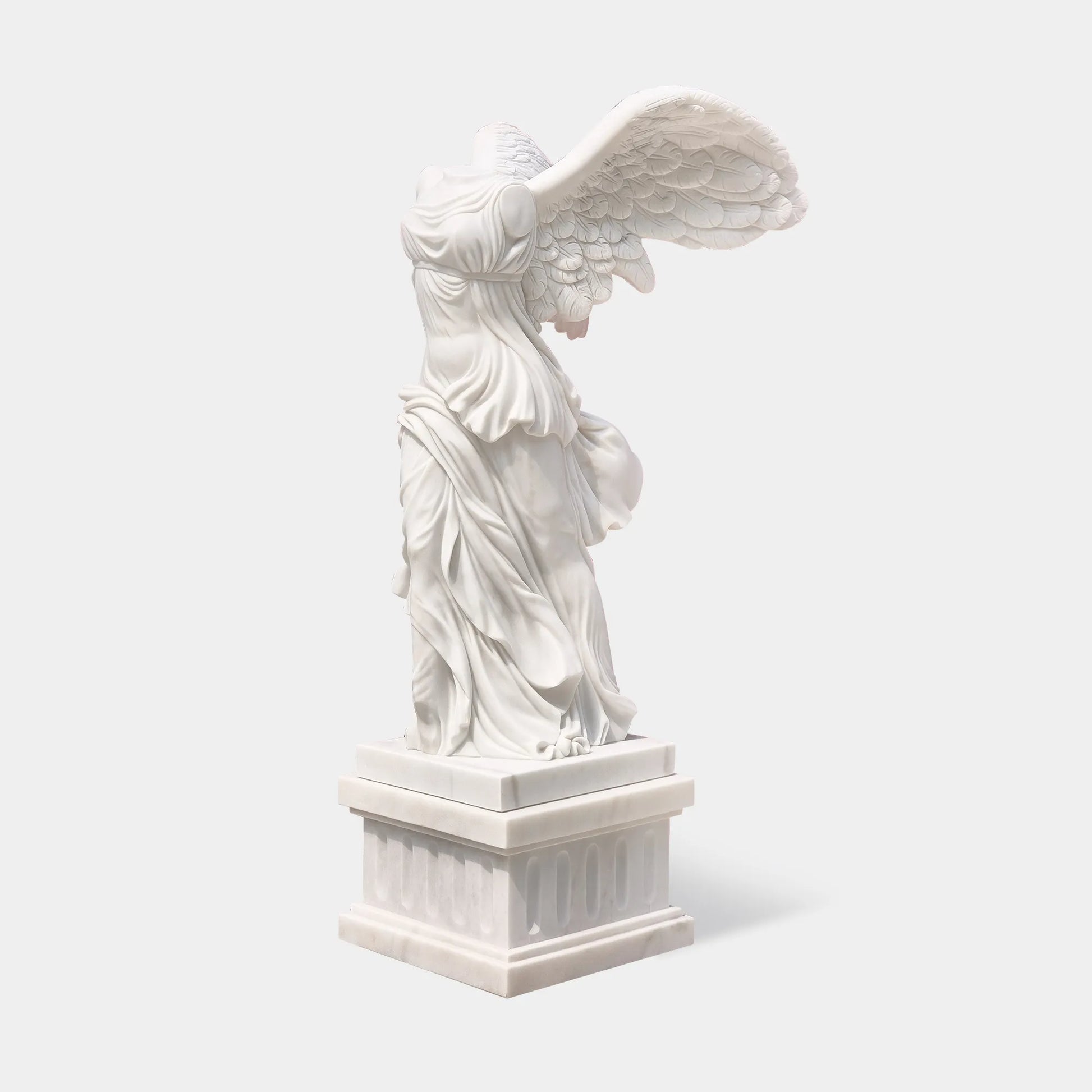 Classical marble sculpture of the Winged Victory of Samothrace with flowing drapery and soaring wings for luxury villas, courtyards, and art galleries.
