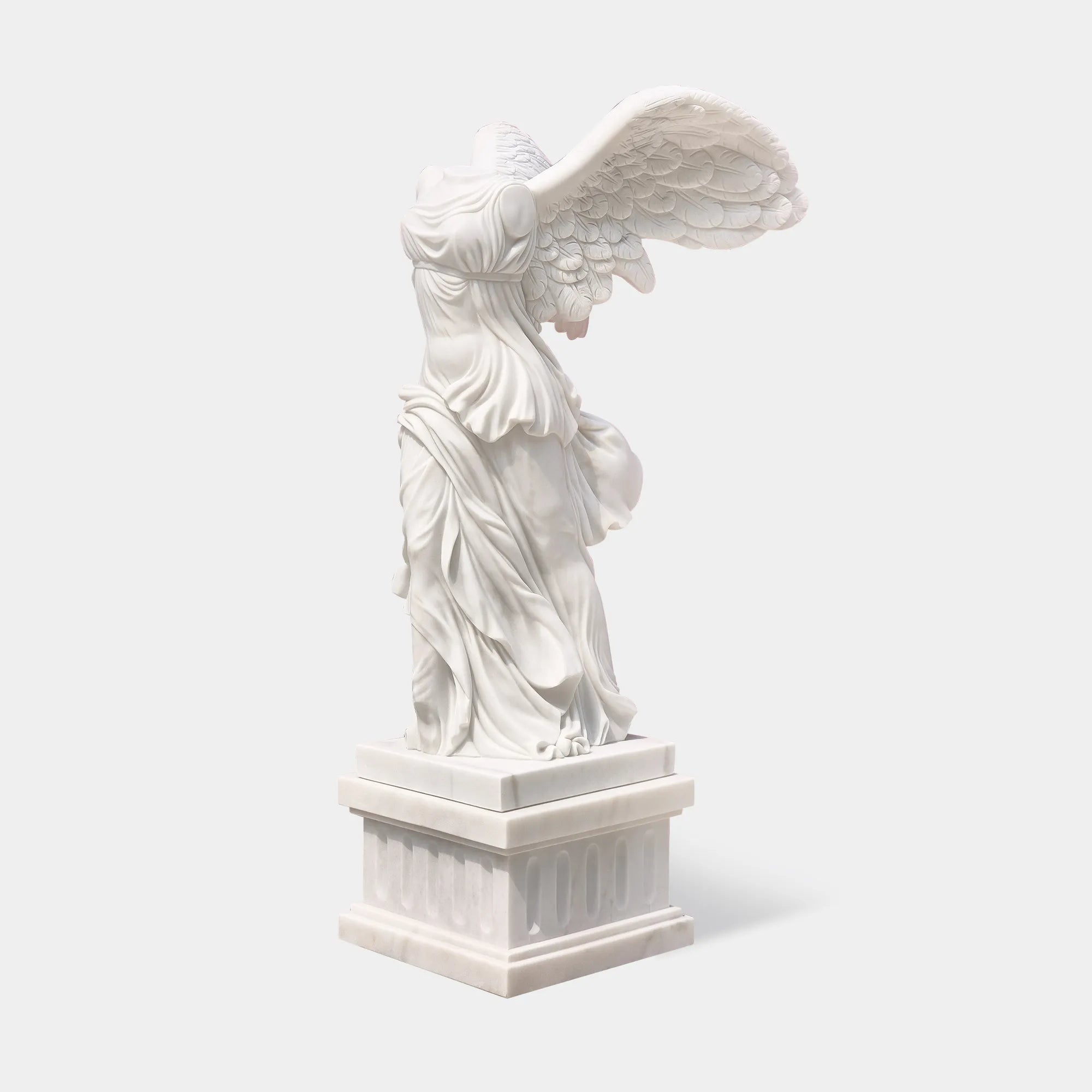 Classical marble sculpture of the Winged Victory of Samothrace with flowing drapery and soaring wings for luxury villas, courtyards, and art galleries.