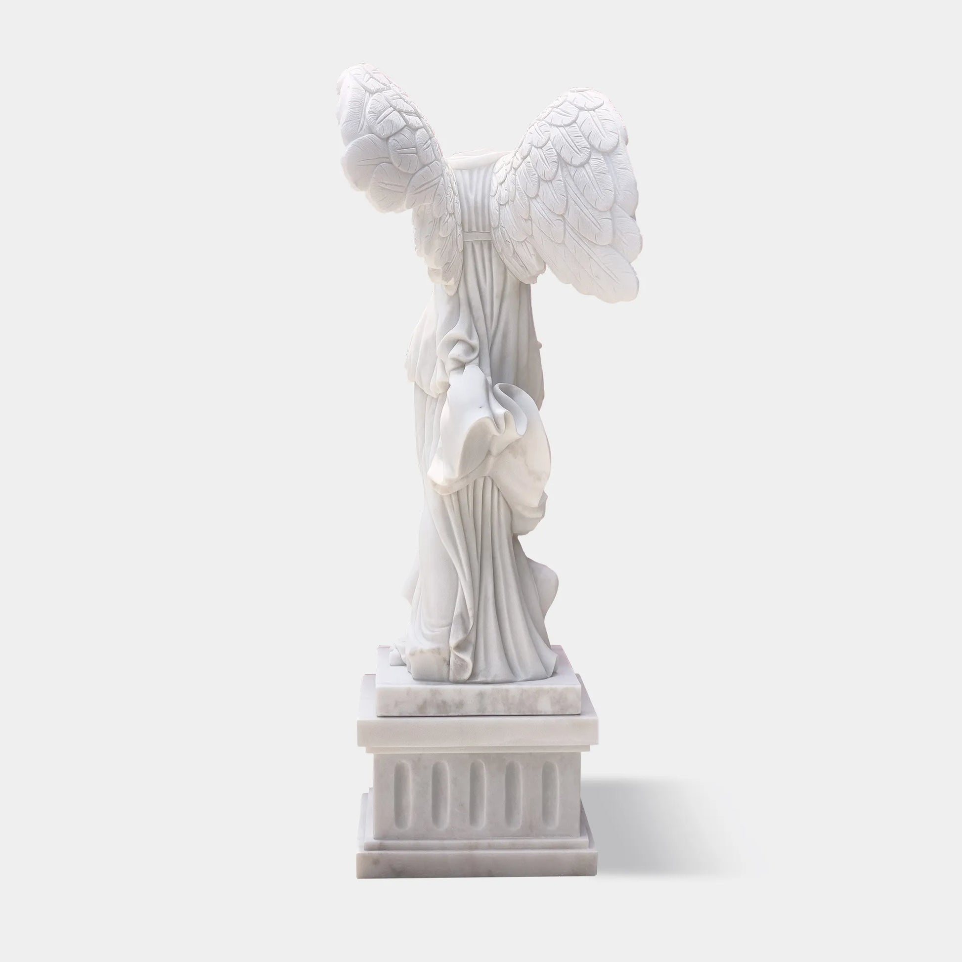 Classical marble sculpture of the Winged Victory of Samothrace with flowing drapery and soaring wings for luxury villas, courtyards, and art galleries.