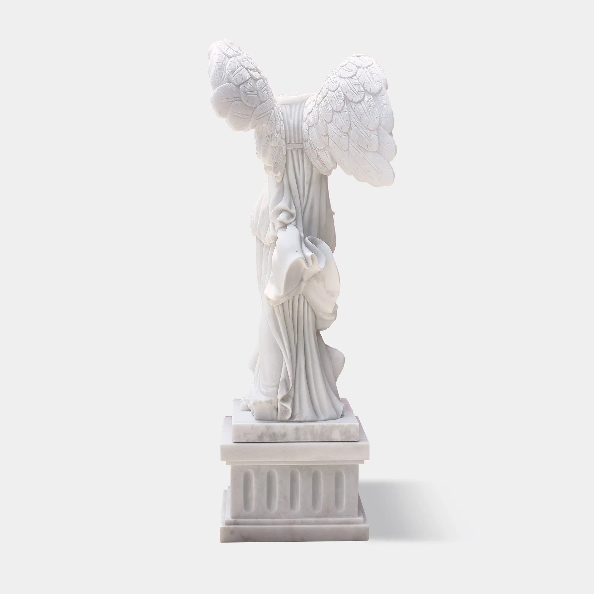 Classical marble sculpture of the Winged Victory of Samothrace with flowing drapery and soaring wings for luxury villas, courtyards, and art galleries.