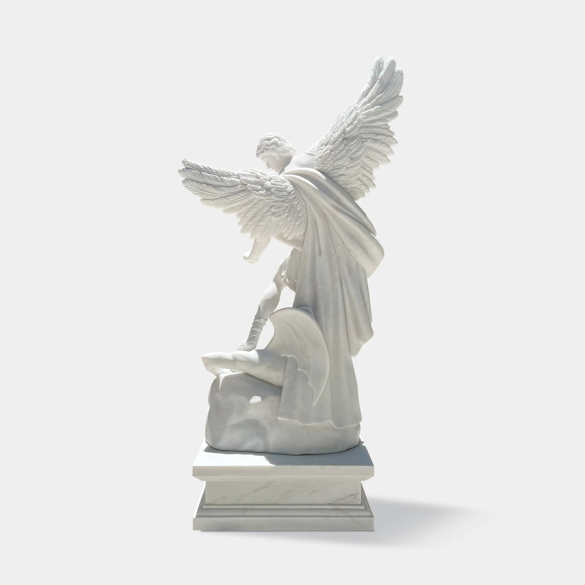 Religious marble sculpture of Saint Michael the Archangel defeating evil, ideal for gardens, churches and memorial spaces.
