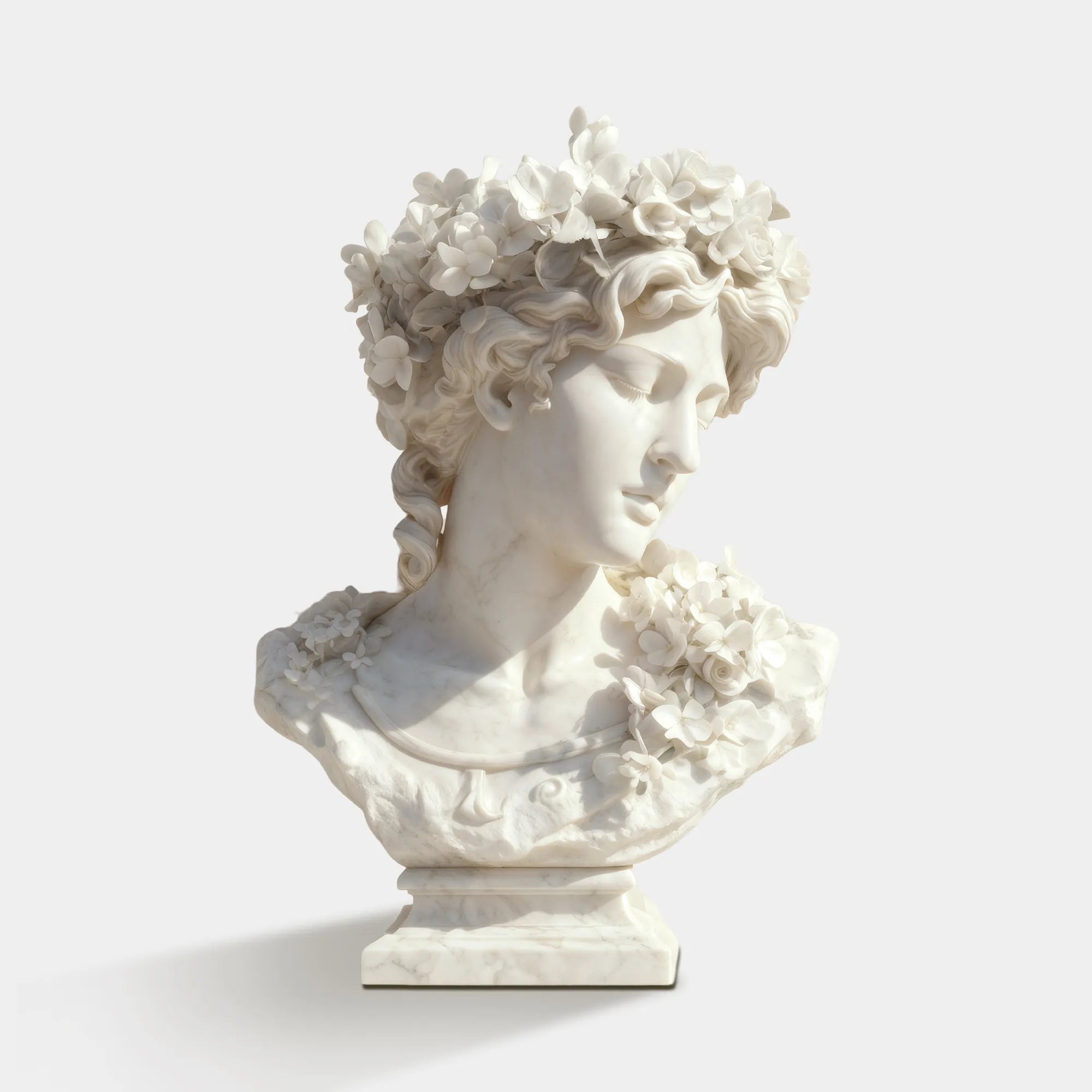 Marble bust of a girl in side profile decorated with fresh flowers for luxury interiors and galleries.
