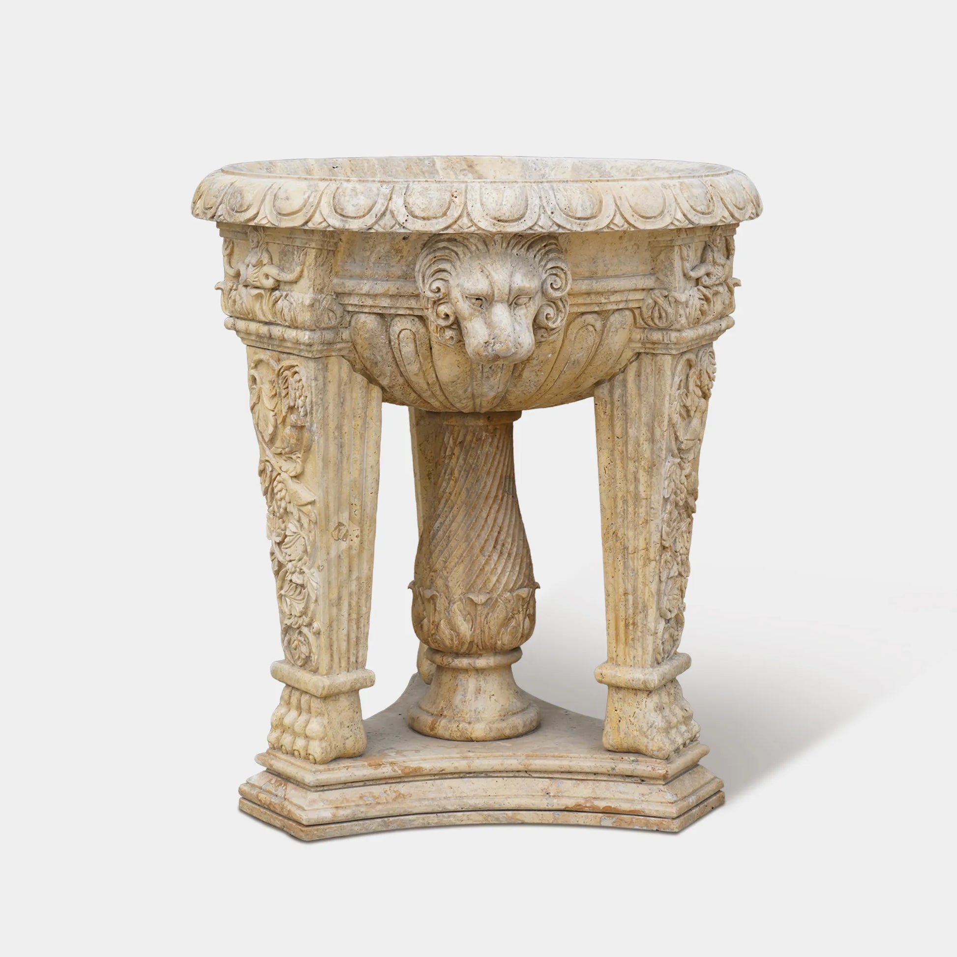 A finely crafted marble jardiniere sculpture with elegant lion heads and classical floral motifs. 