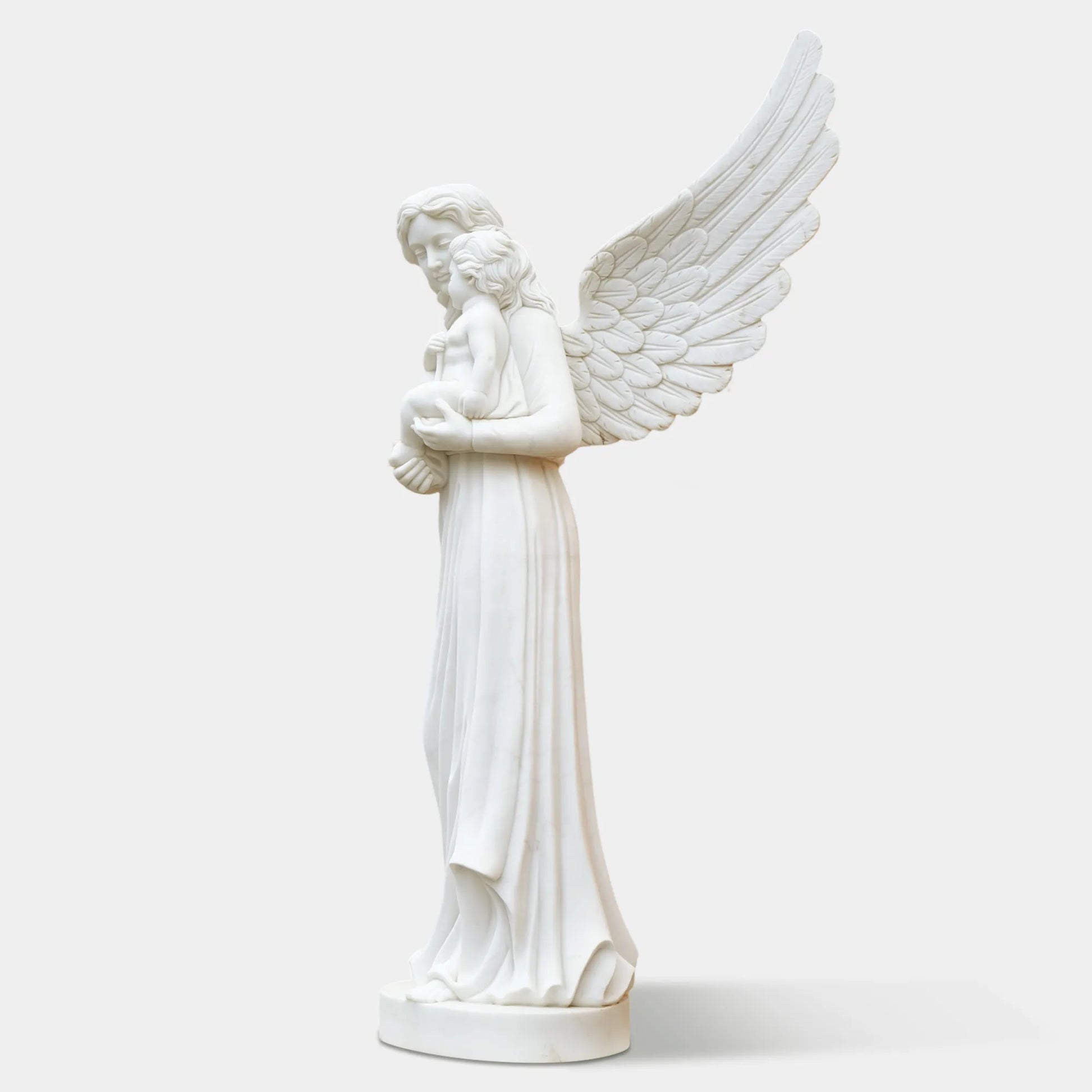 Outdoor marble angel with child sculpture displayed in a classical garden.