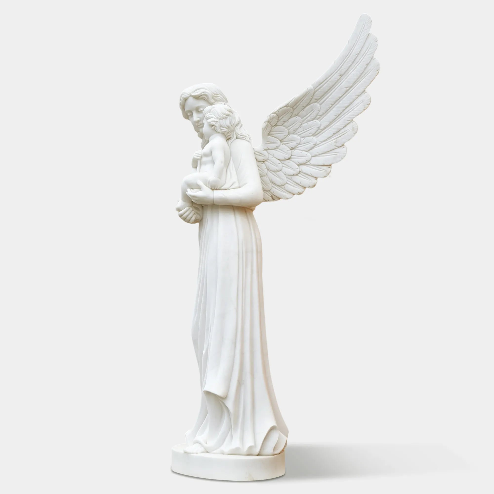 Outdoor marble angel with child sculpture displayed in a classical garden.