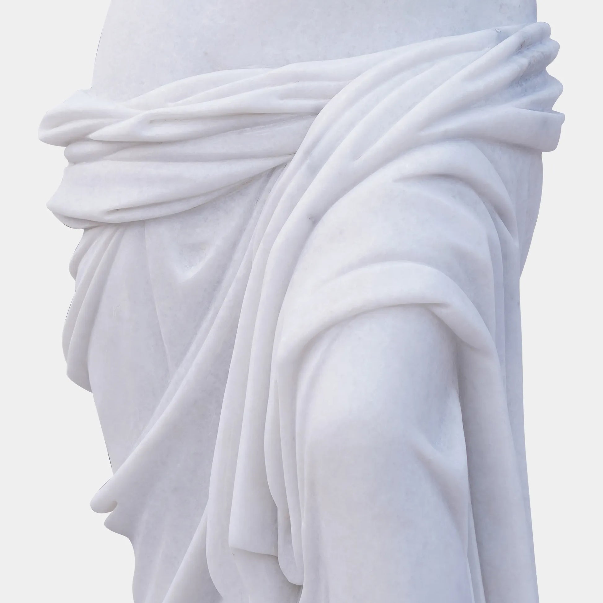 Marble sculpture of Venus de Milo with detailed Greek design standing on a pedestal.