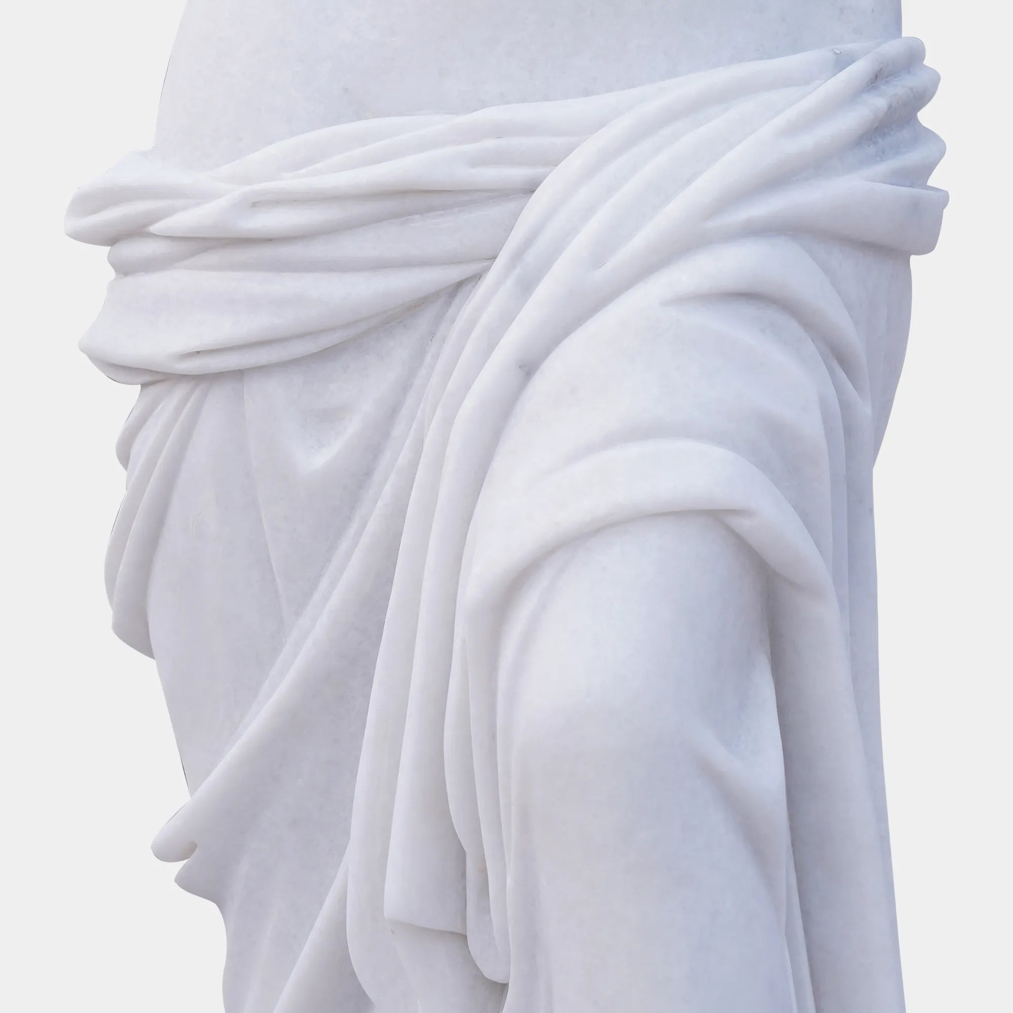 Marble sculpture of Venus de Milo with detailed Greek design standing on a pedestal.