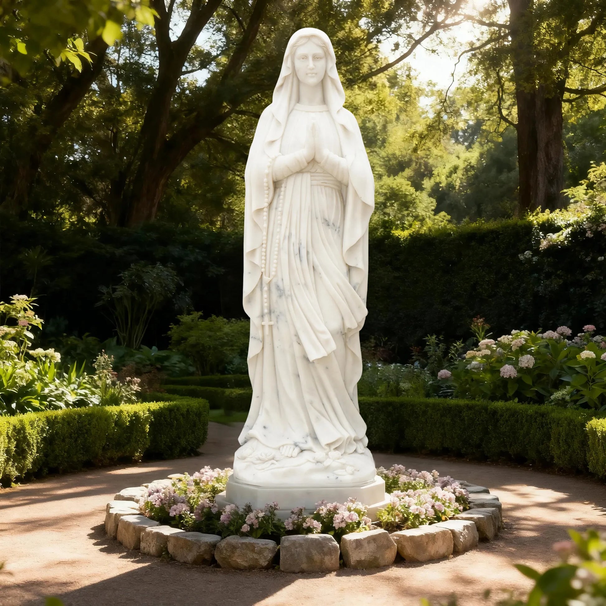 Marble sculpture of Virgin Mary standing in prayer with detailed robe texture displayed in a church or outdoor garden.