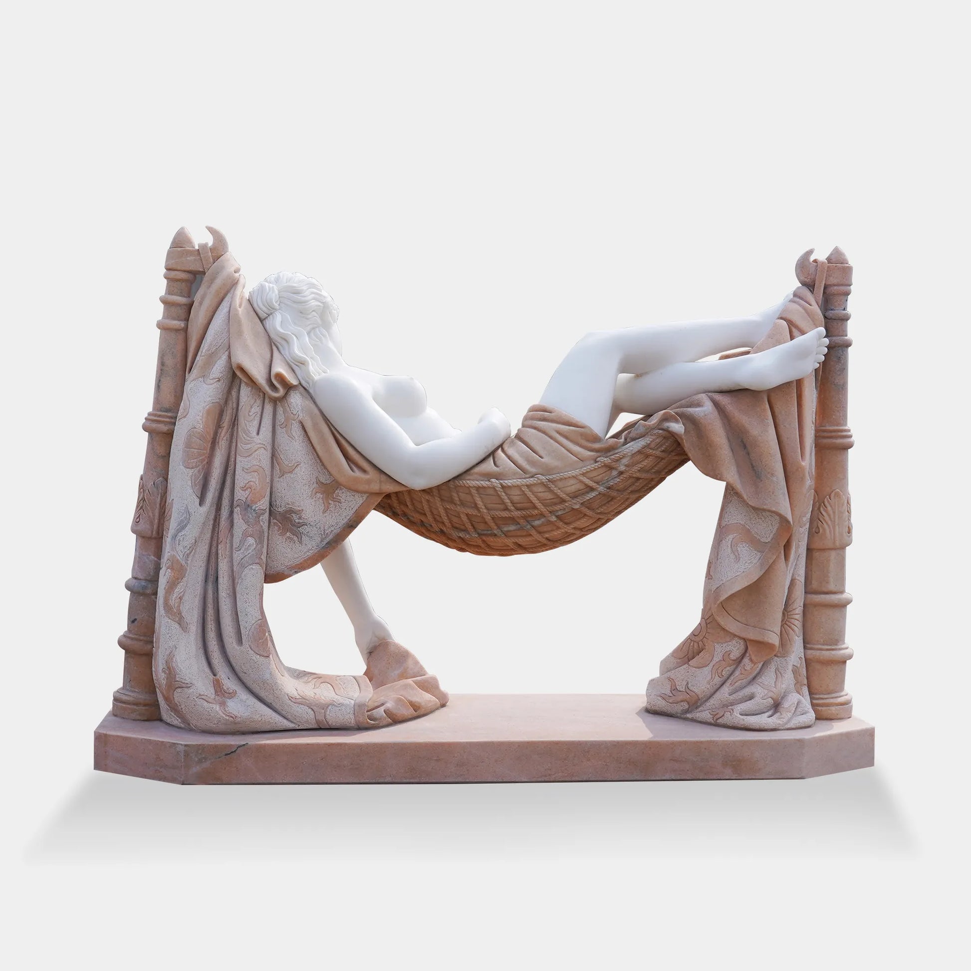 Marble sculpture of woman lying in hammock in villa garden.