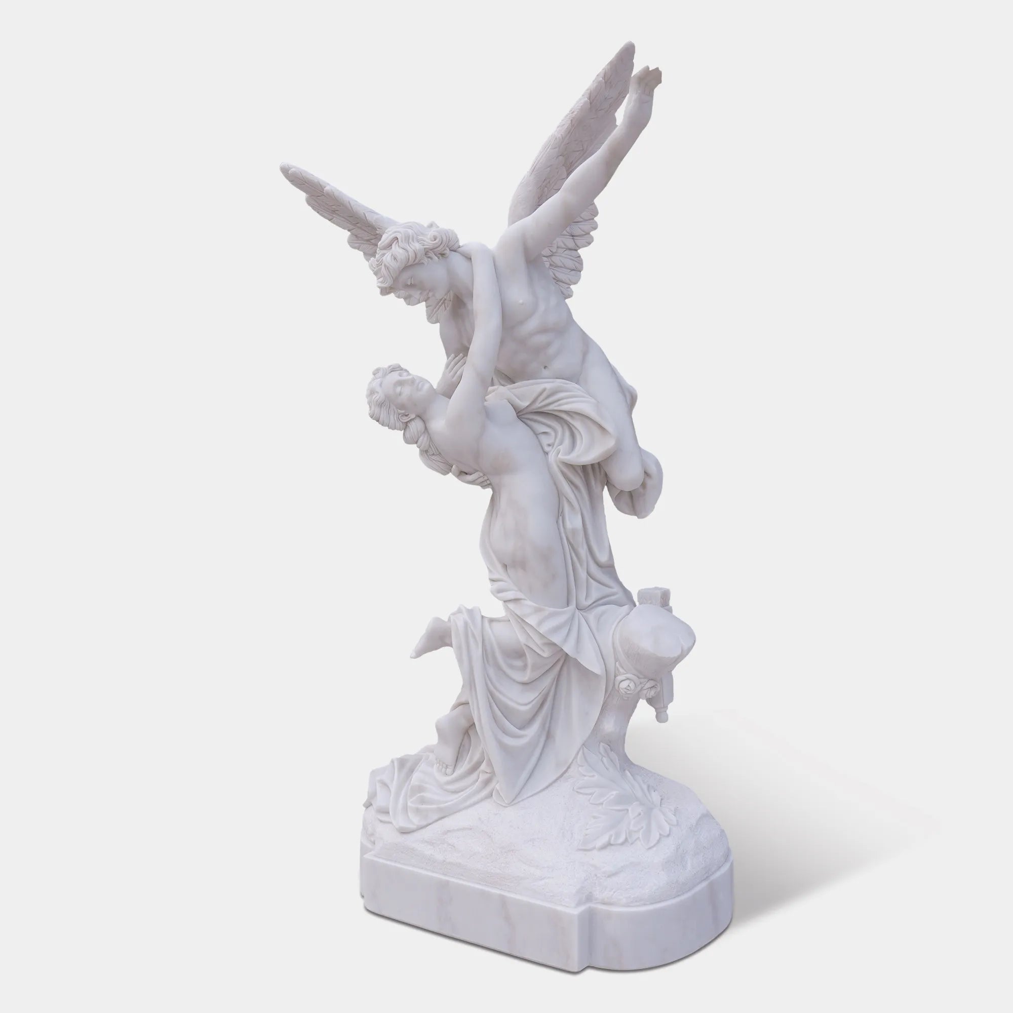 Marble sculpture of Cupid and Psyche with detailed wings and flowing forms.