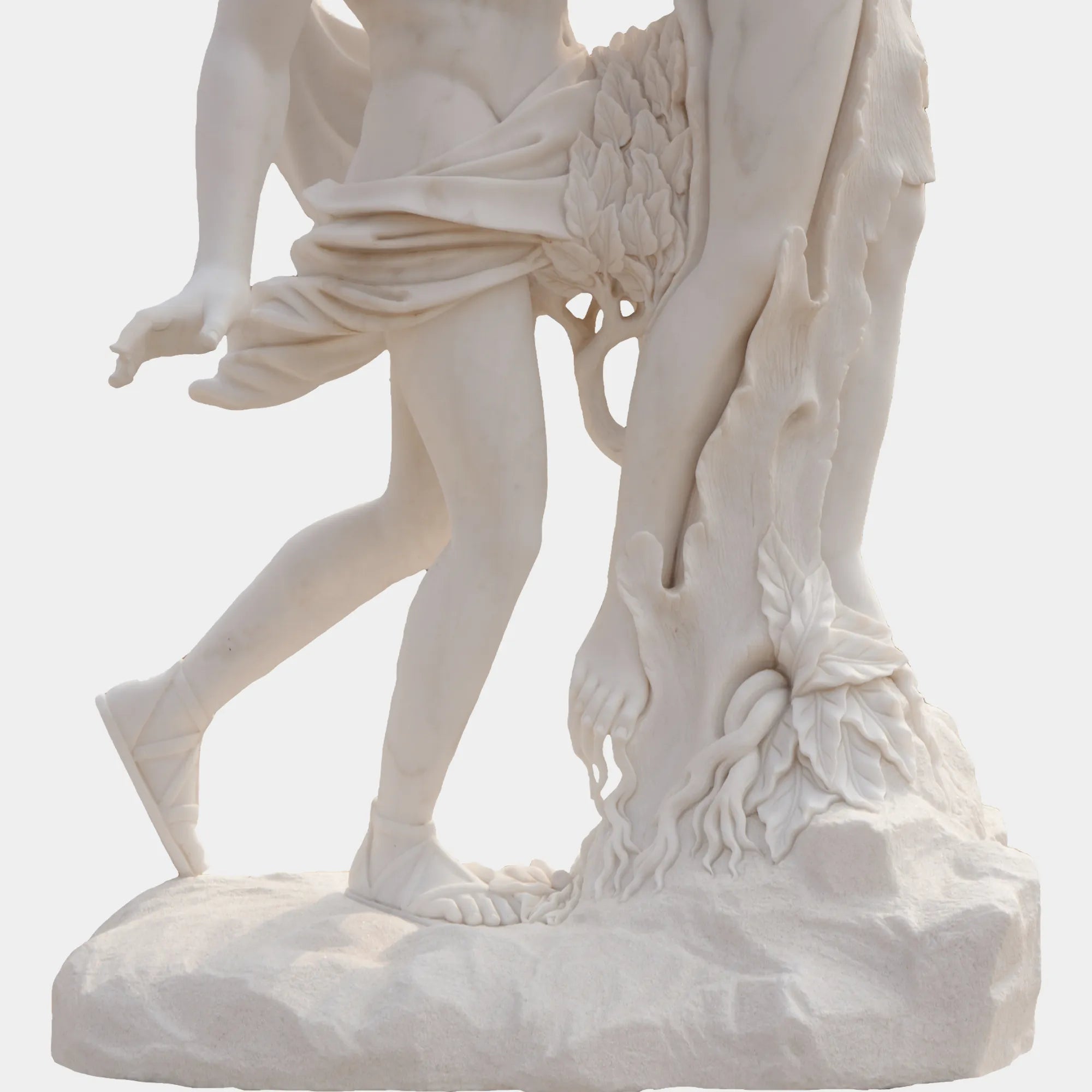 Marble sculpture of Apollo and Daphne in transformation, showing Apollo reaching for Daphne as she turns into a laurel tree, displayed outdoors in a classical courtyard with marble arches and palm trees.