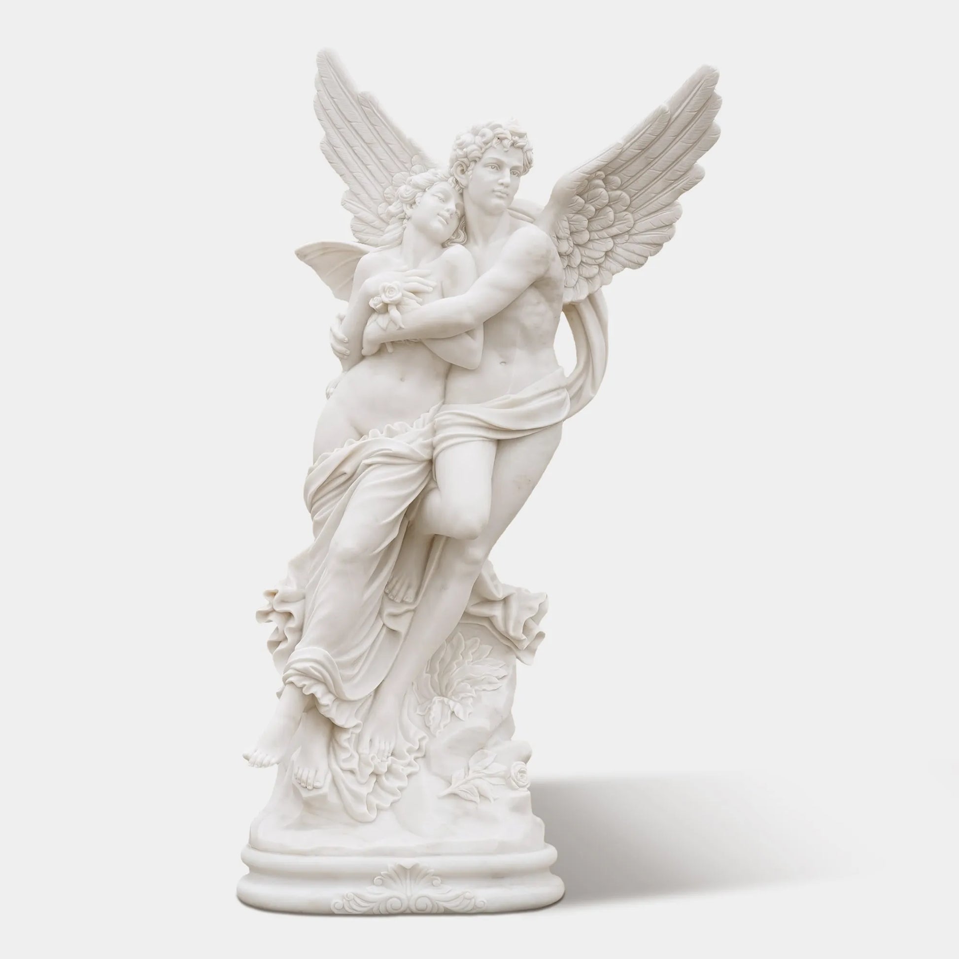 Romantic marble sculpture of Cupid and Psyche in elegant villa garden, showing detailed wings and graceful embrace under sunlight.