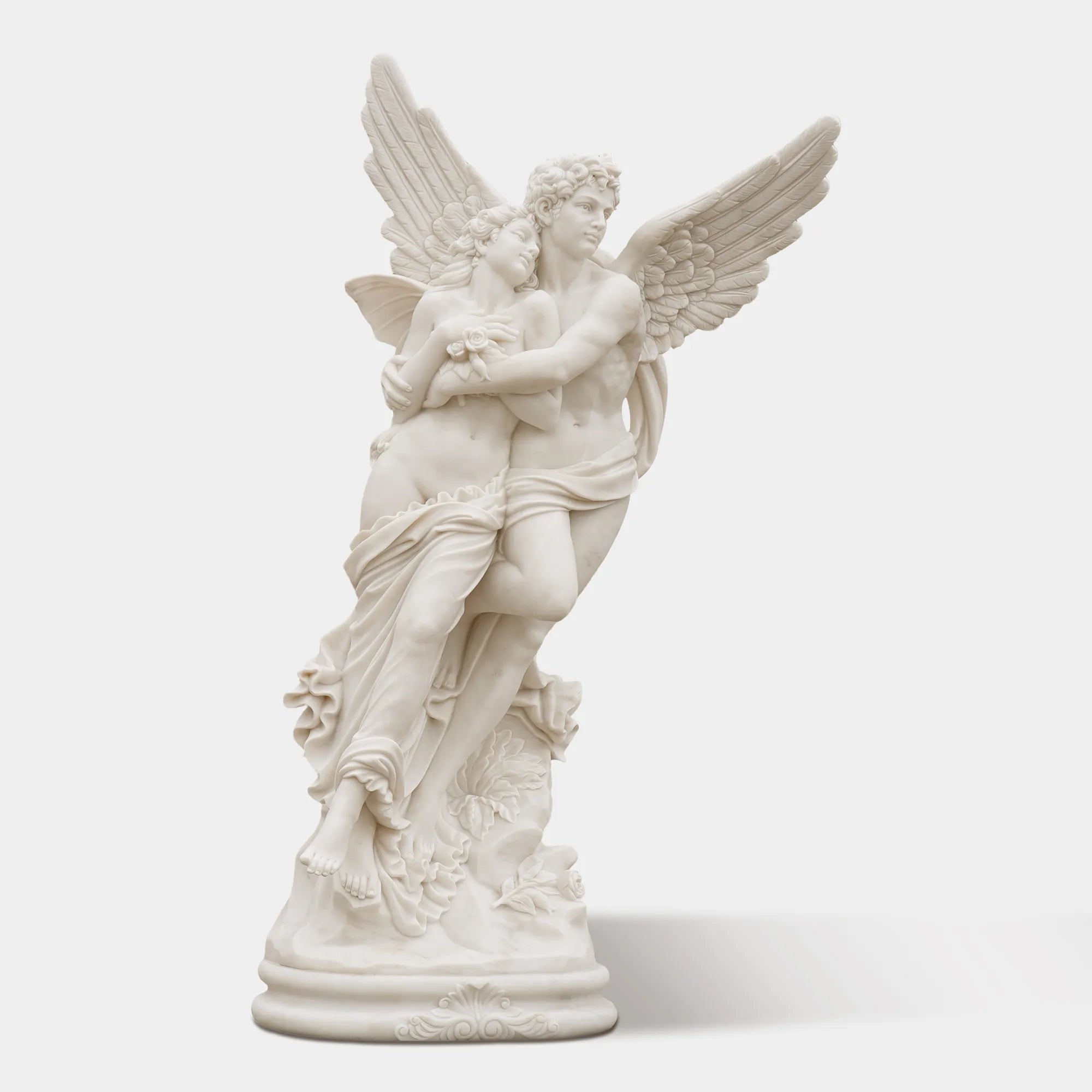 Romantic marble sculpture of Cupid and Psyche in elegant villa garden, showing detailed wings and graceful embrace under sunlight.