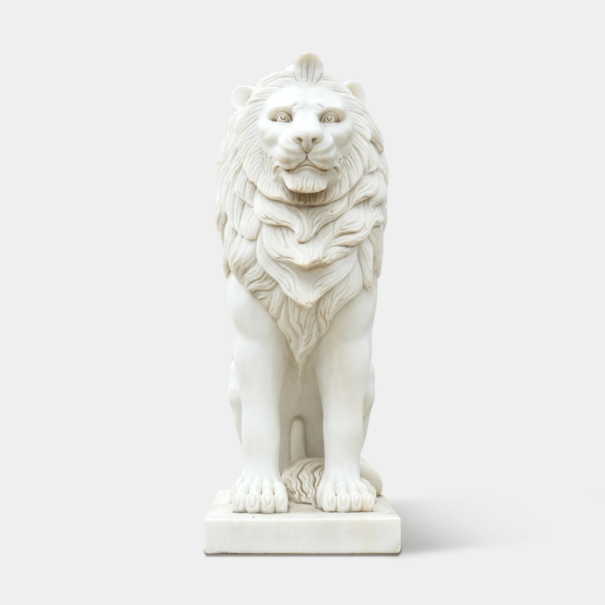 Contemporary marble lion statue with smooth polished surface and refined details.
