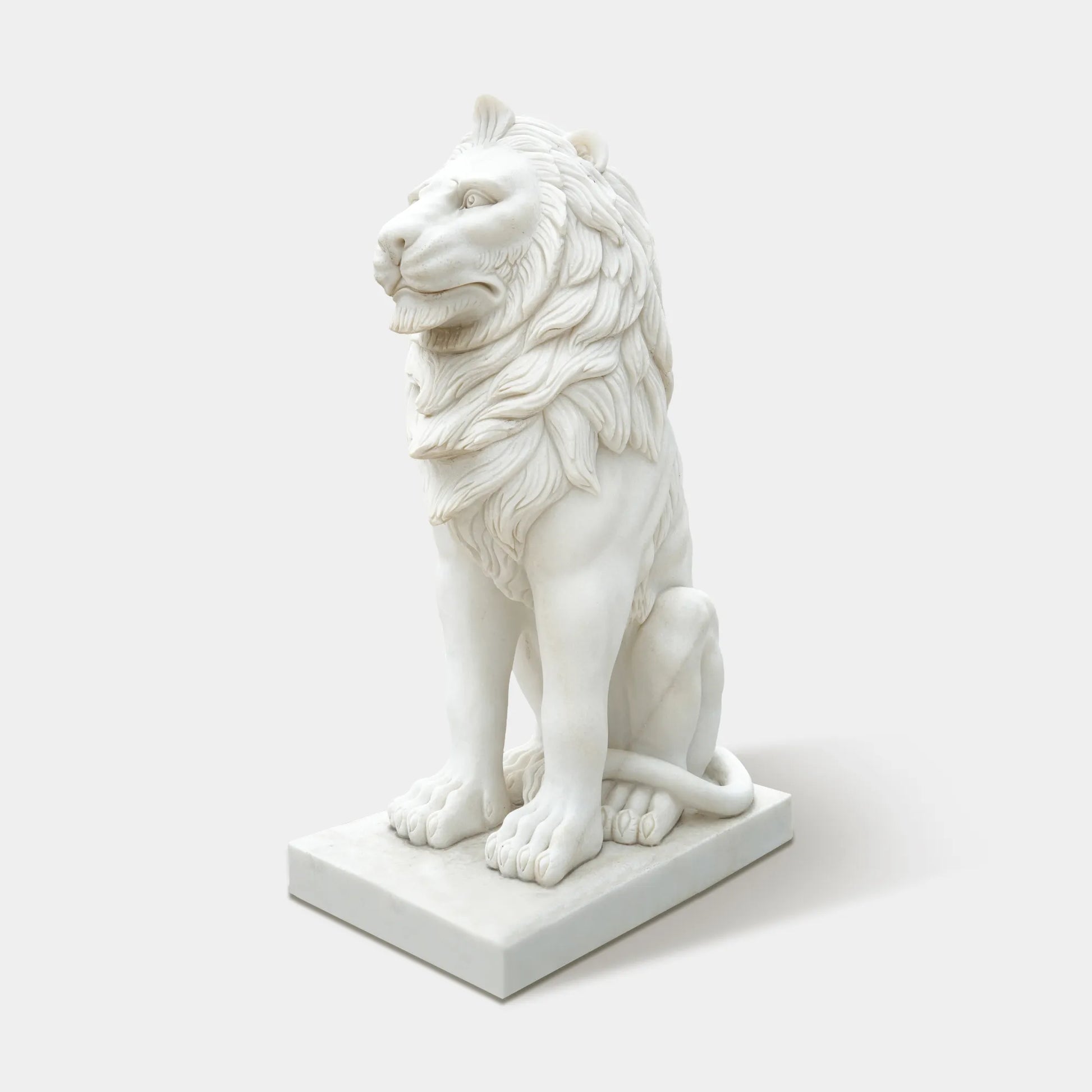 Contemporary marble lion statue with smooth polished surface and refined details.