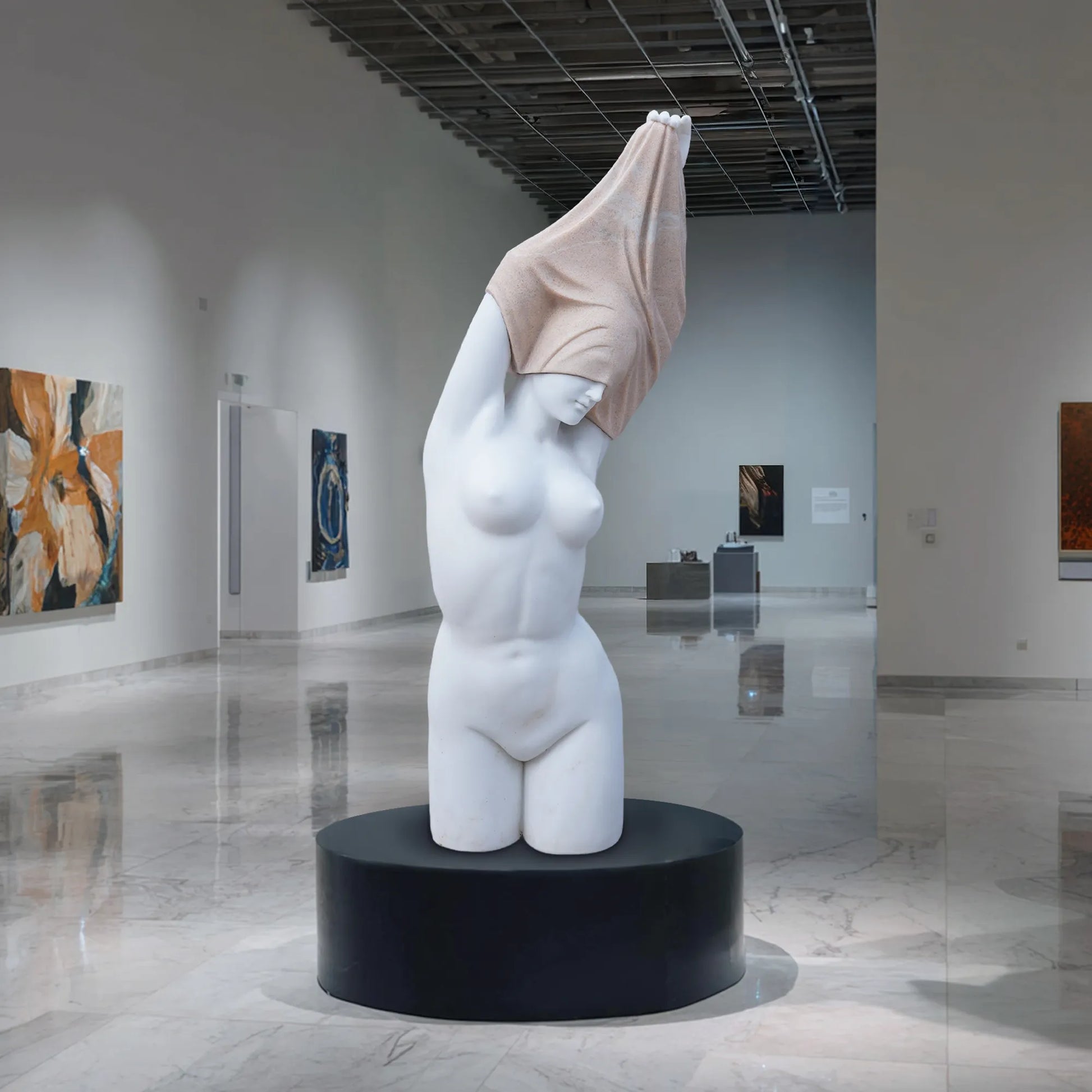 Marble female torso sculpture with raised arms and covered head on pedestal.