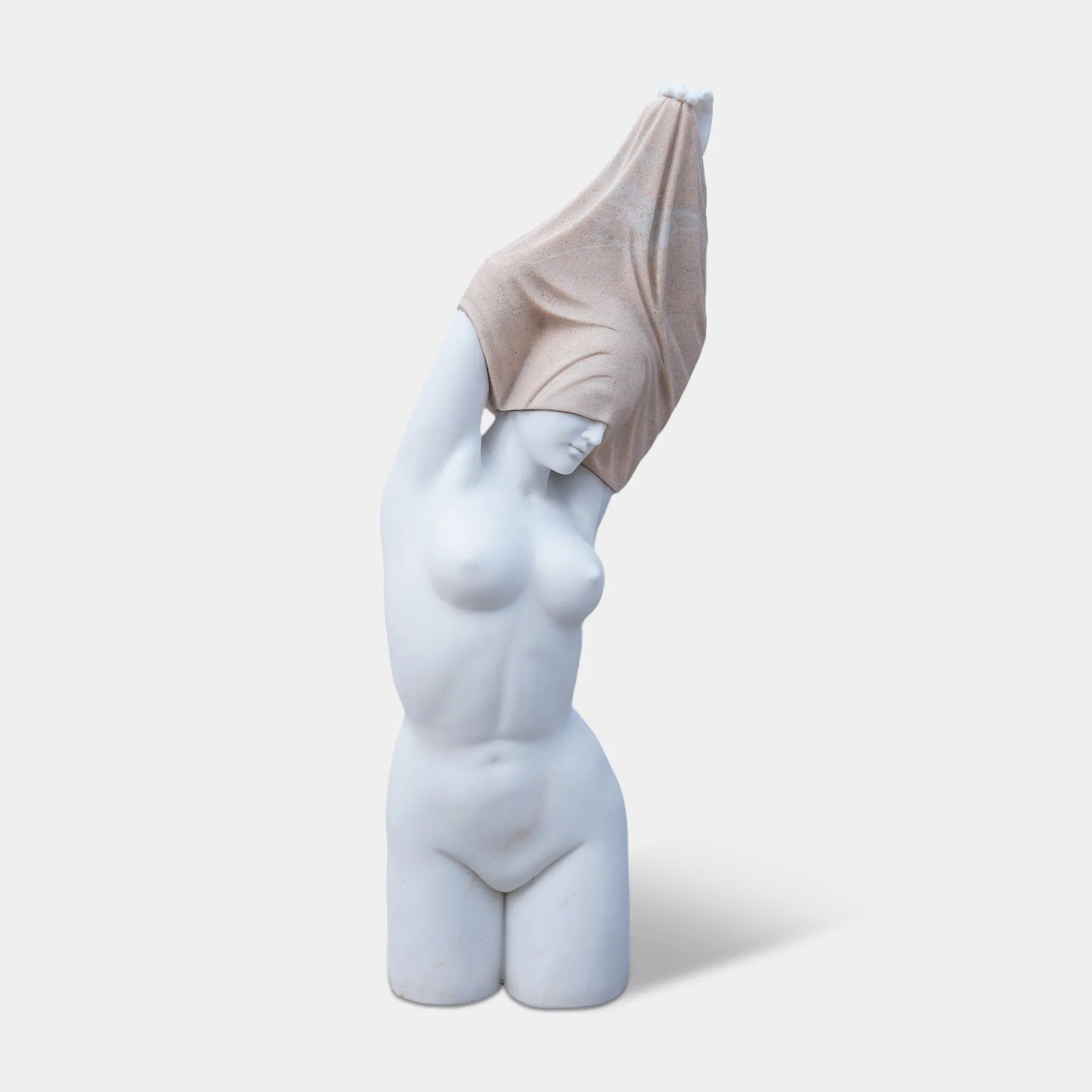 Marble female torso sculpture with raised arms and covered head on pedestal.
