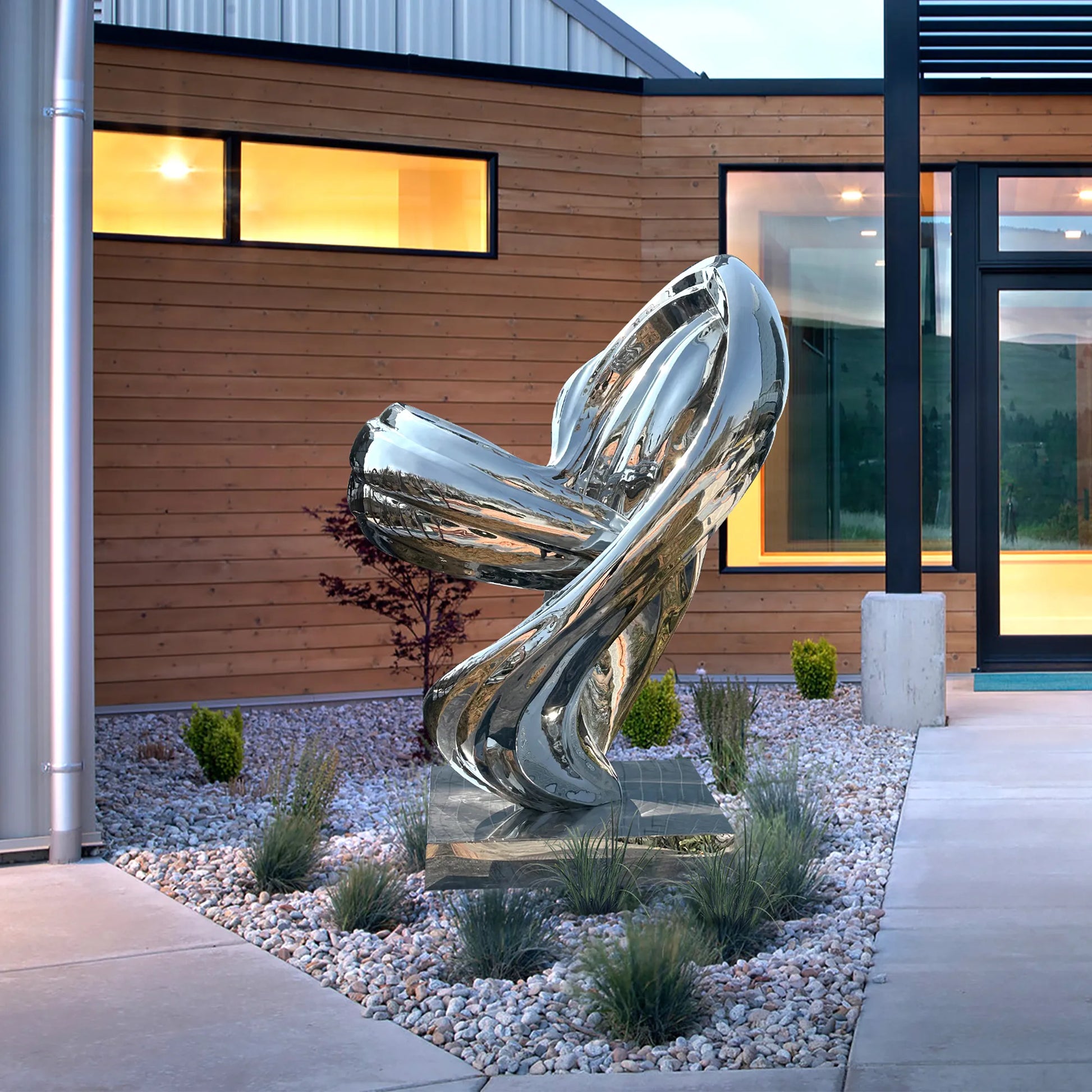 Abstract stainless steel sculpture with flowing interwoven curves and modern polished mirror finish for luxury gardens, plazas, and art galleries.