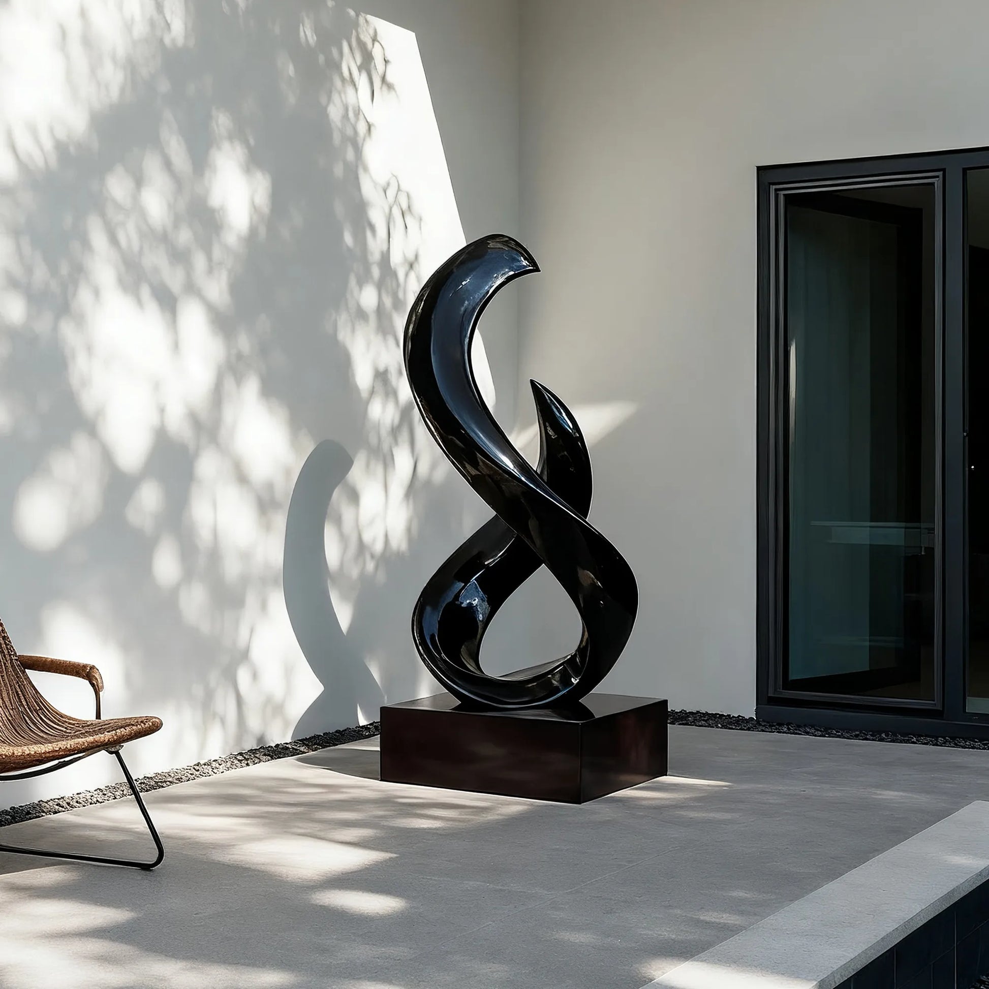 Abstract stainless steel sculpture with flowing form, ideal for luxury villas, hotel lobbies, and art galleries.