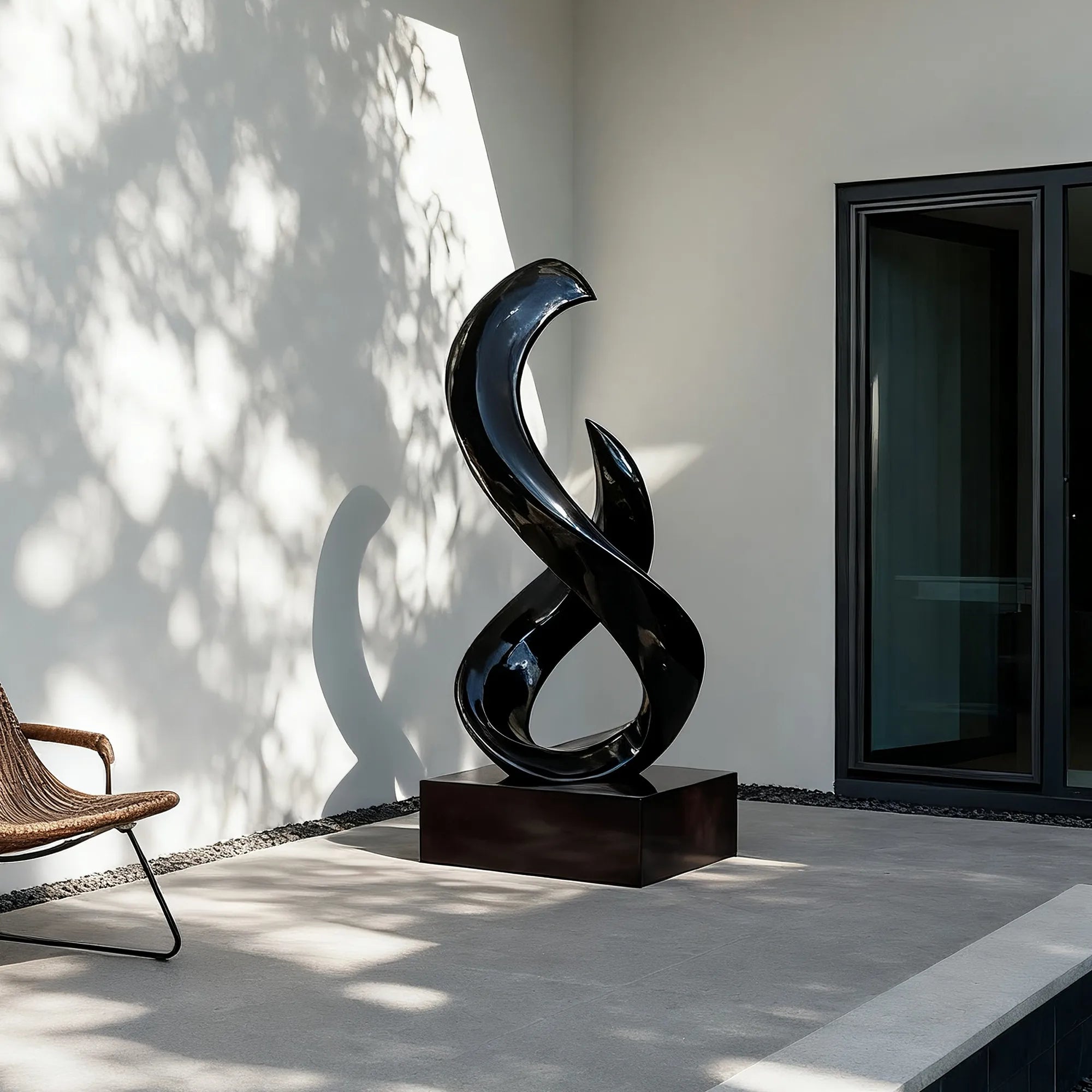 Abstract stainless steel sculpture with flowing form, ideal for luxury villas, hotel lobbies, and art galleries.