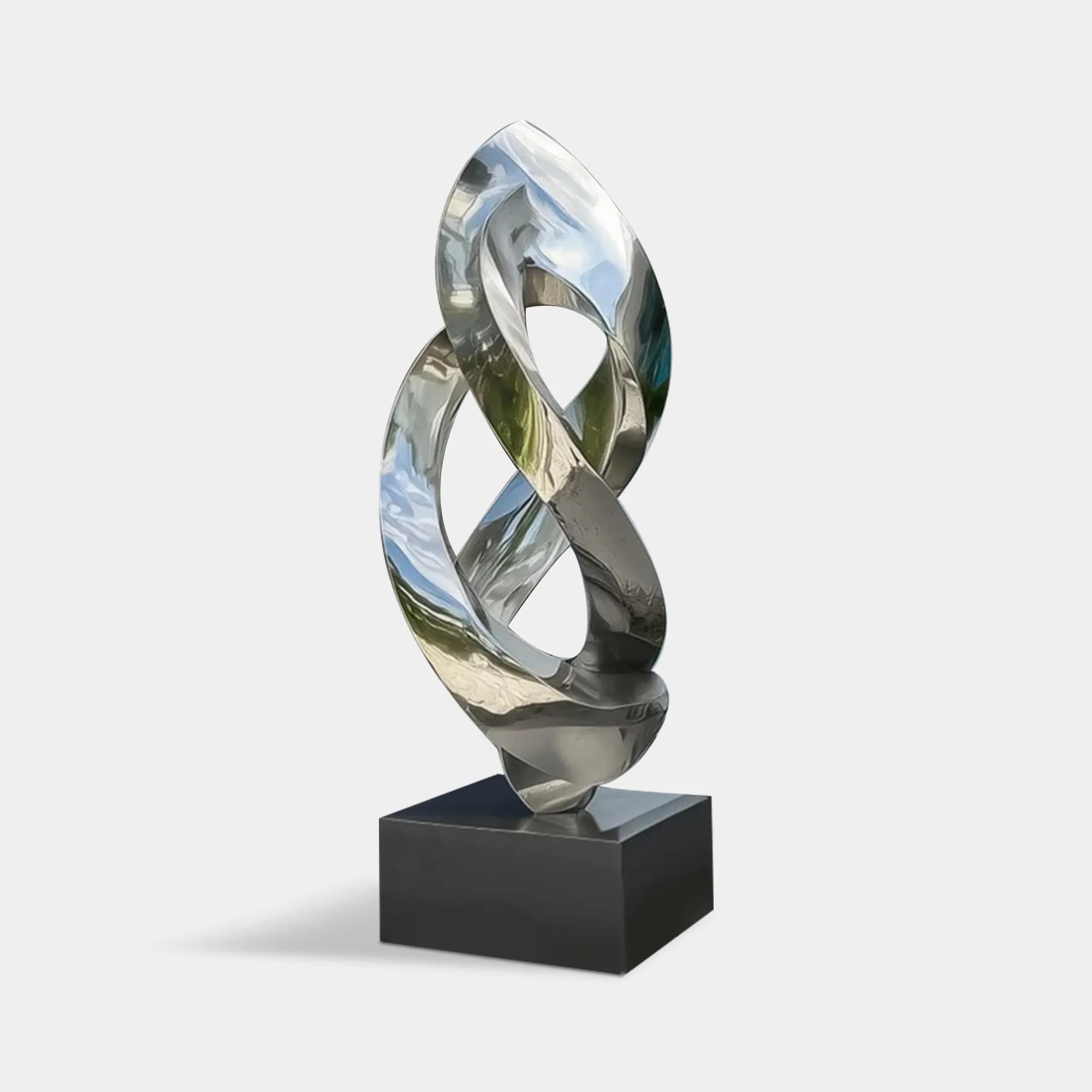 Modern stainless steel sculpture with a spiral design for gardens.