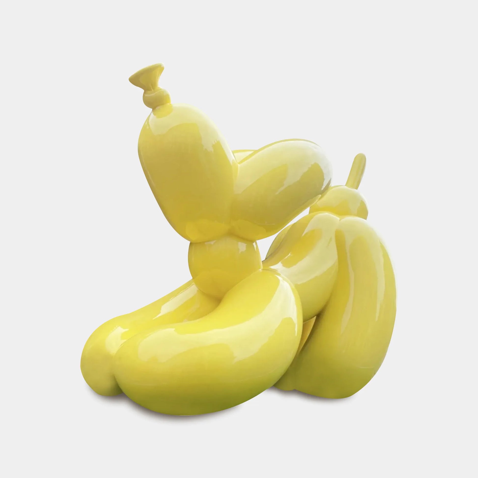 Custom stainless steel sculpture in a yellow balloon dog design for gardens.