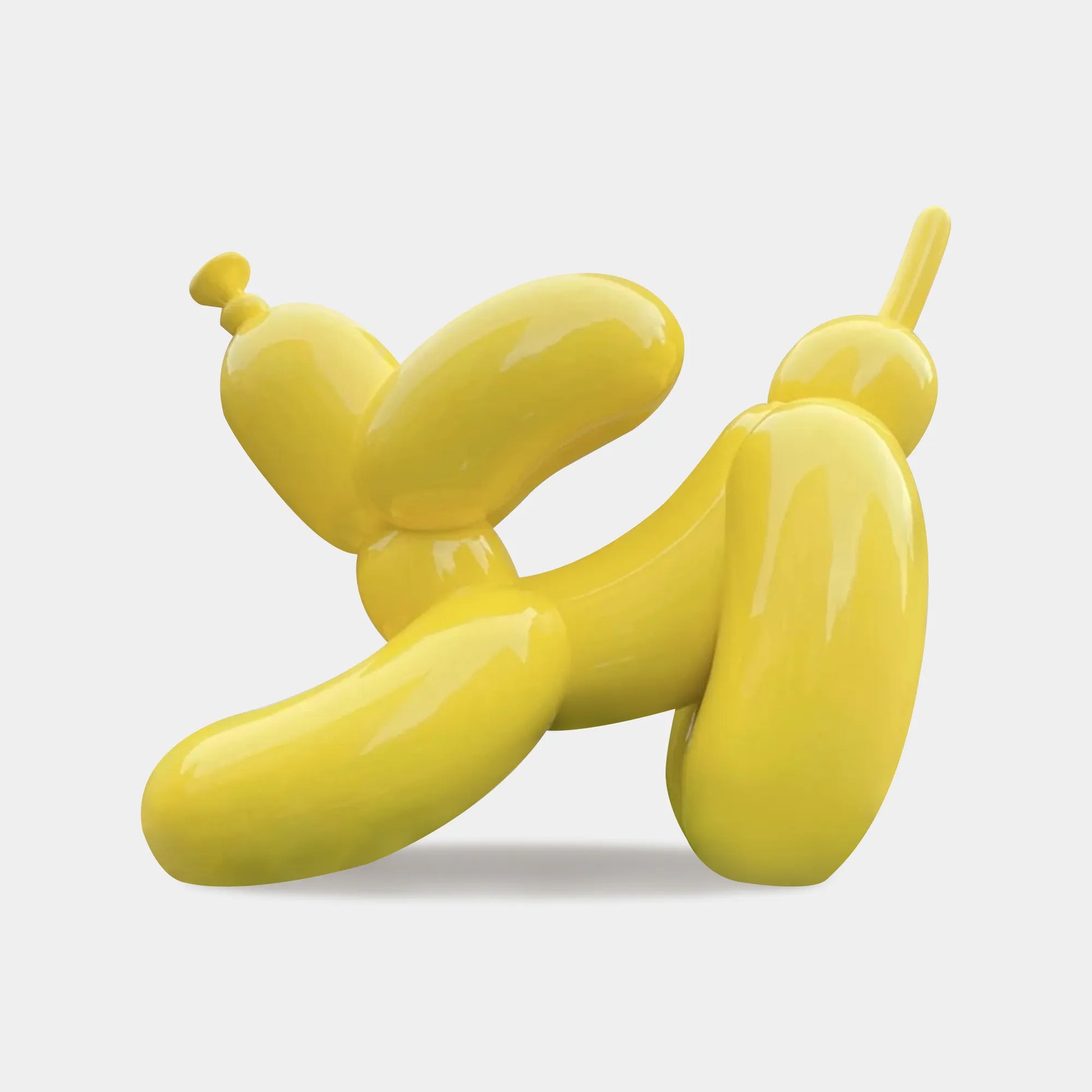 Custom stainless steel sculpture in a yellow balloon dog design for gardens.