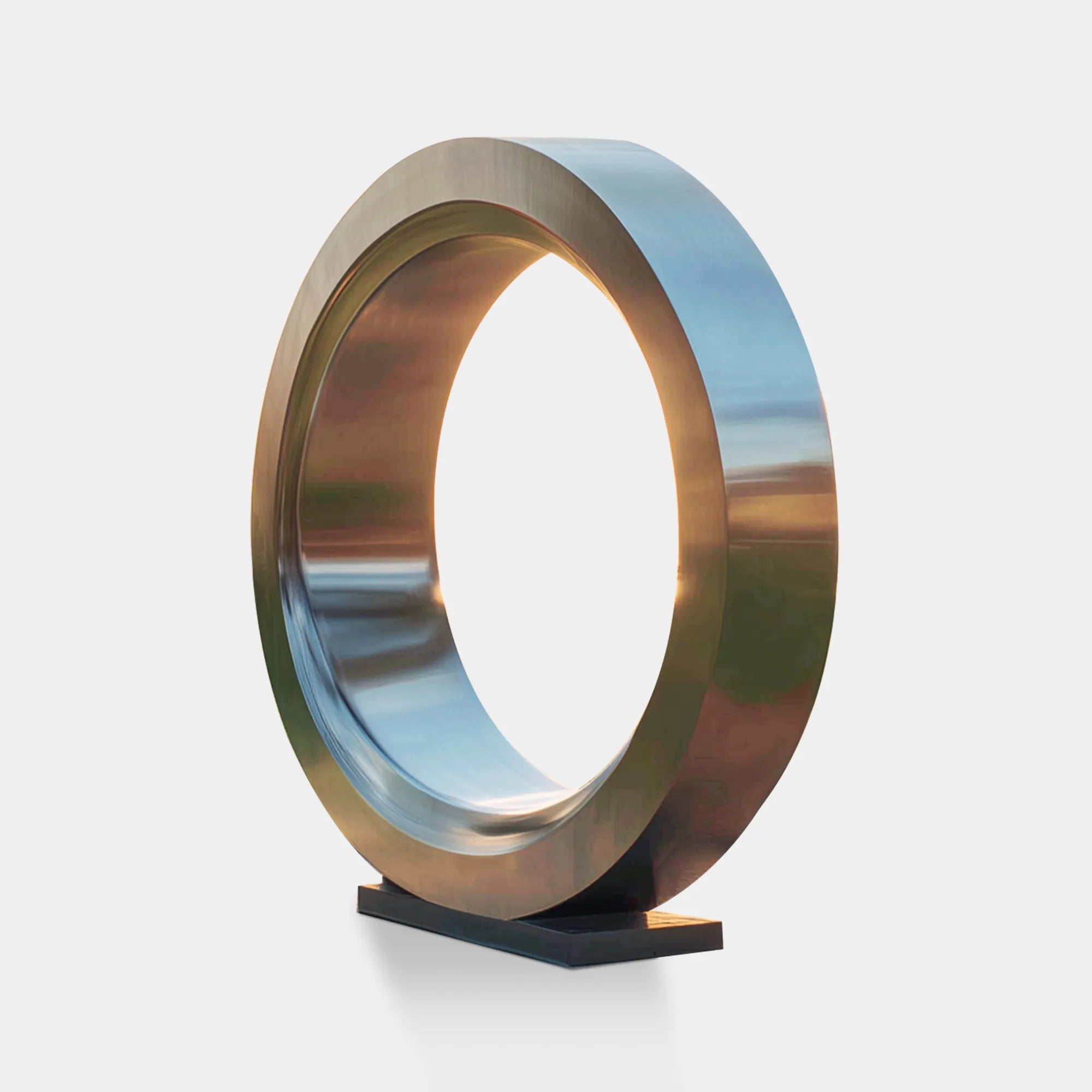 Modern ring sculpture in stainless steel for gardens and parks.
