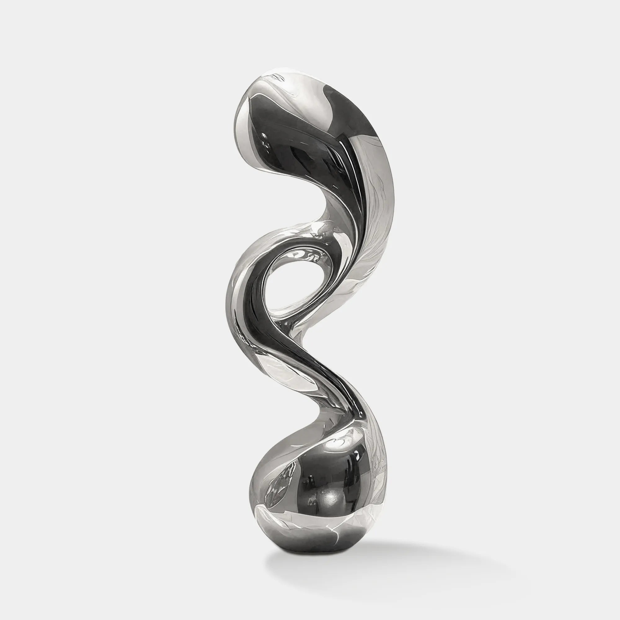 Modern stainless steel tabletop sculpture with abstract design, ideal for luxury interiors and offices.