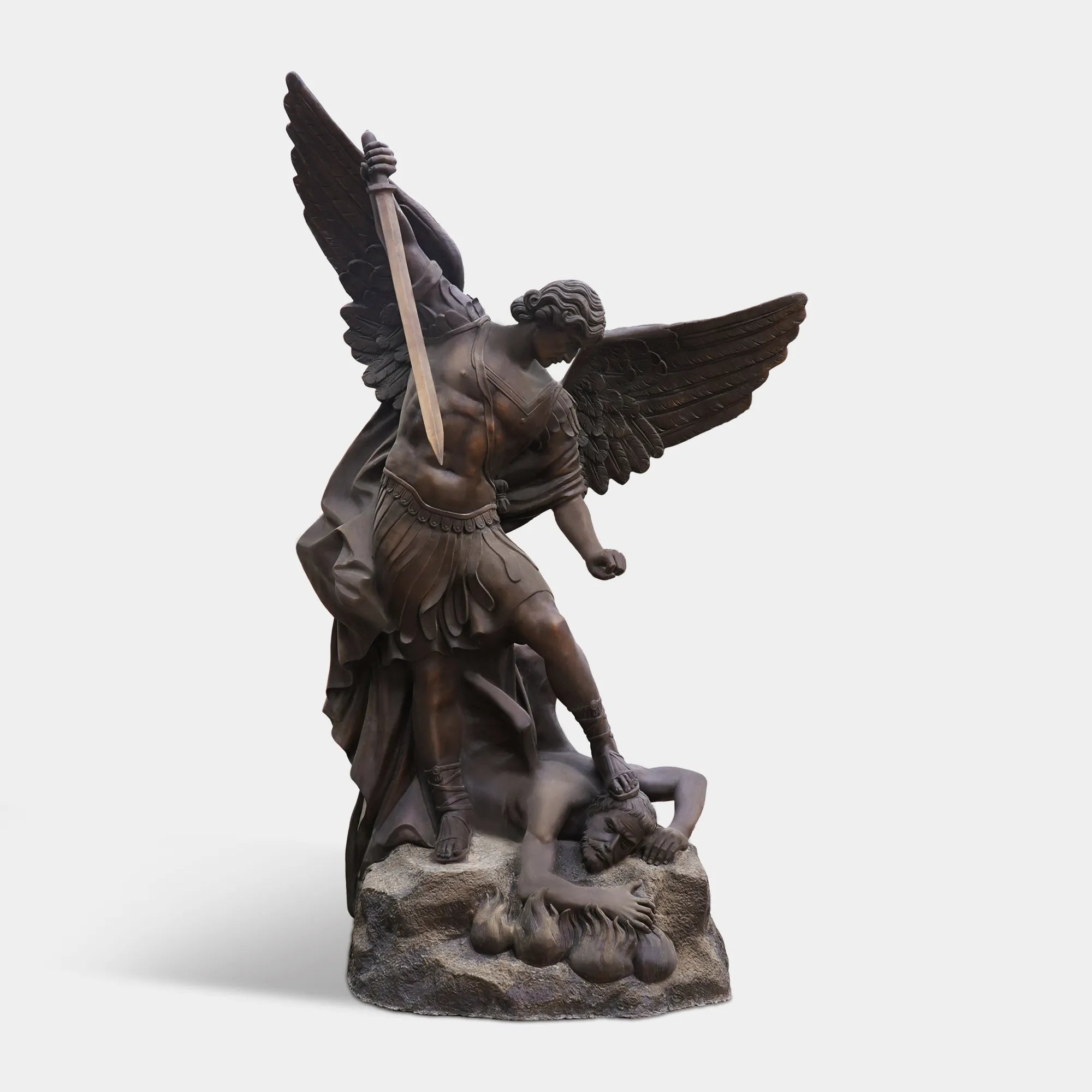 Bronze archangel sculpture with sword and wings for cathedral and memorial settings