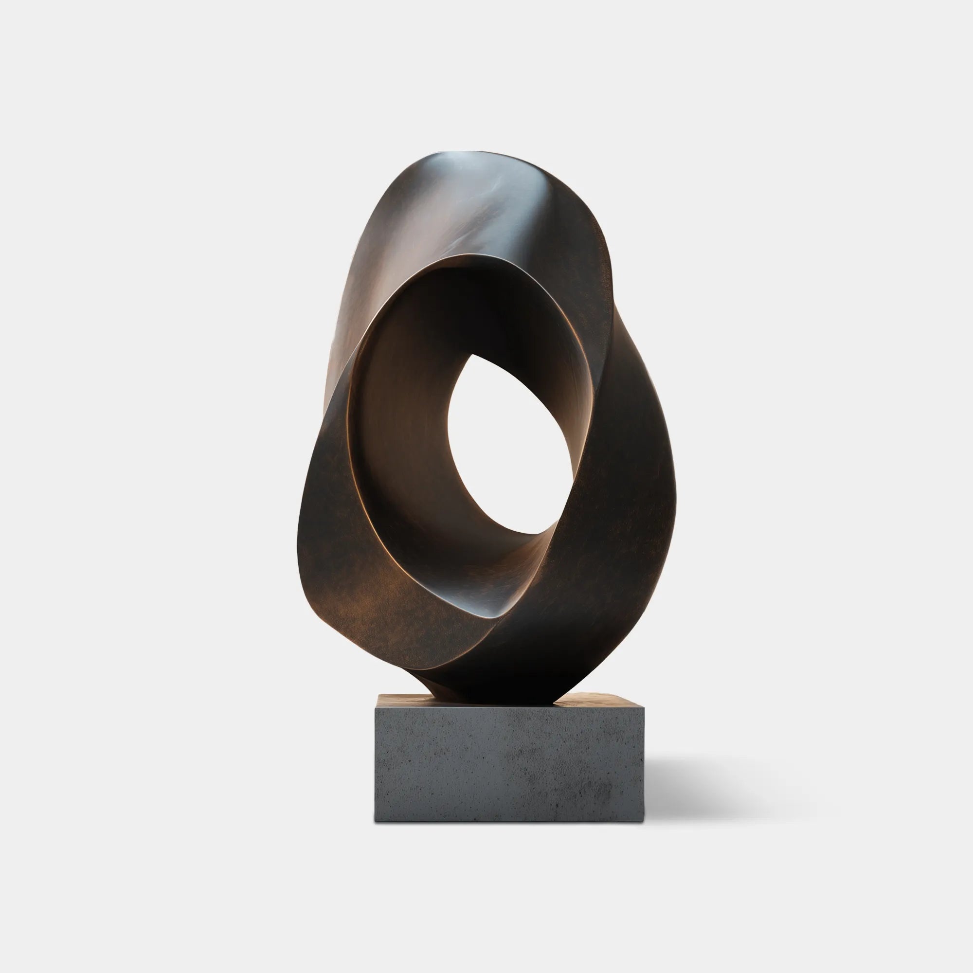 Abstract bronze sculpture with hollow organic form with base in the hallway of a modern villa.