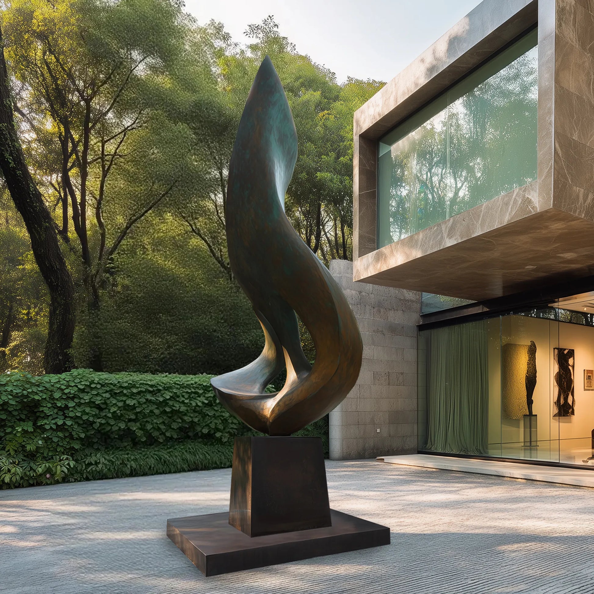 Patinated bronze flowing form sculpture on a pedestal in front of a modern residence with surrounding trees and landscaped garden.