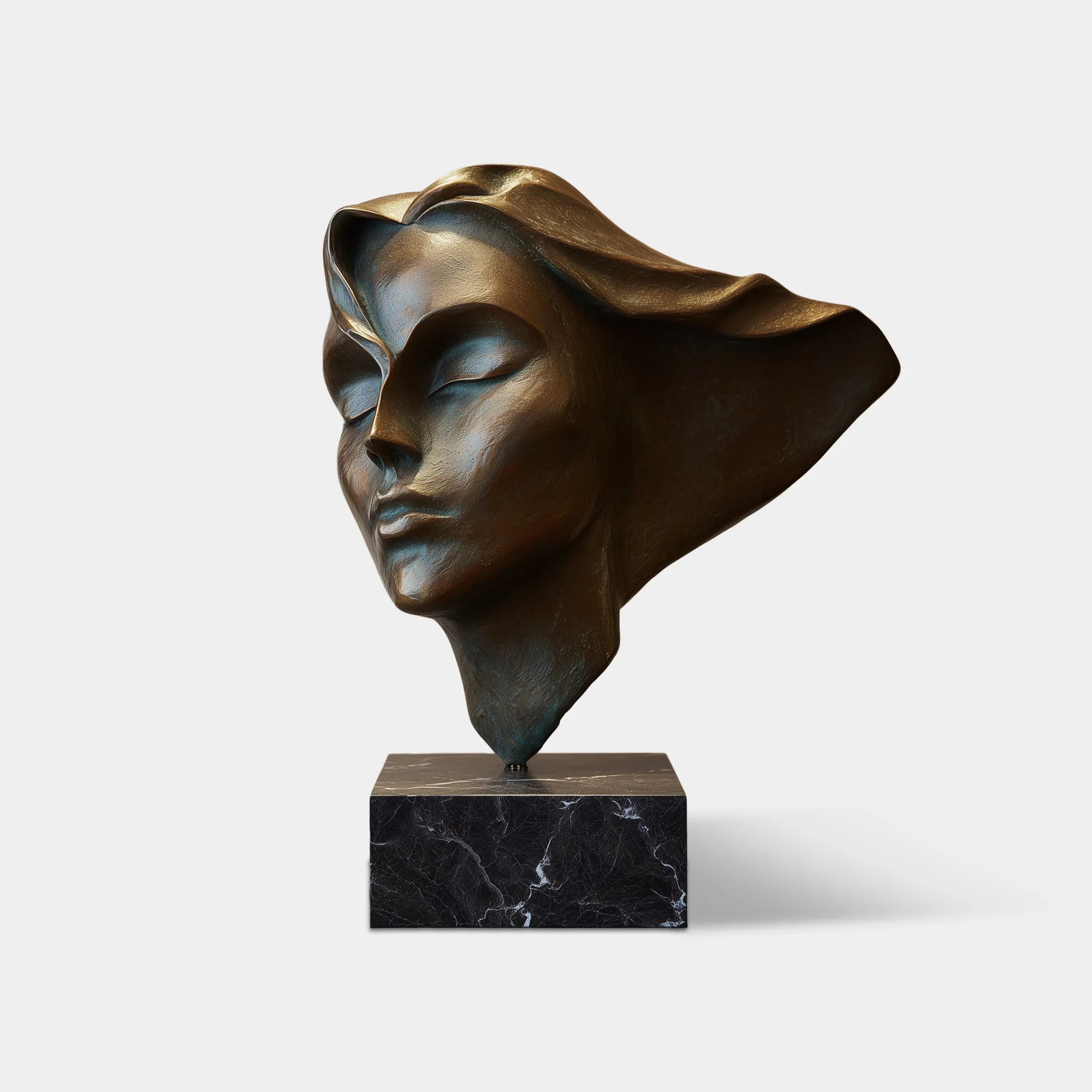 A woman bronze bust with flowing hair is bathing in natural light inside a modern home.