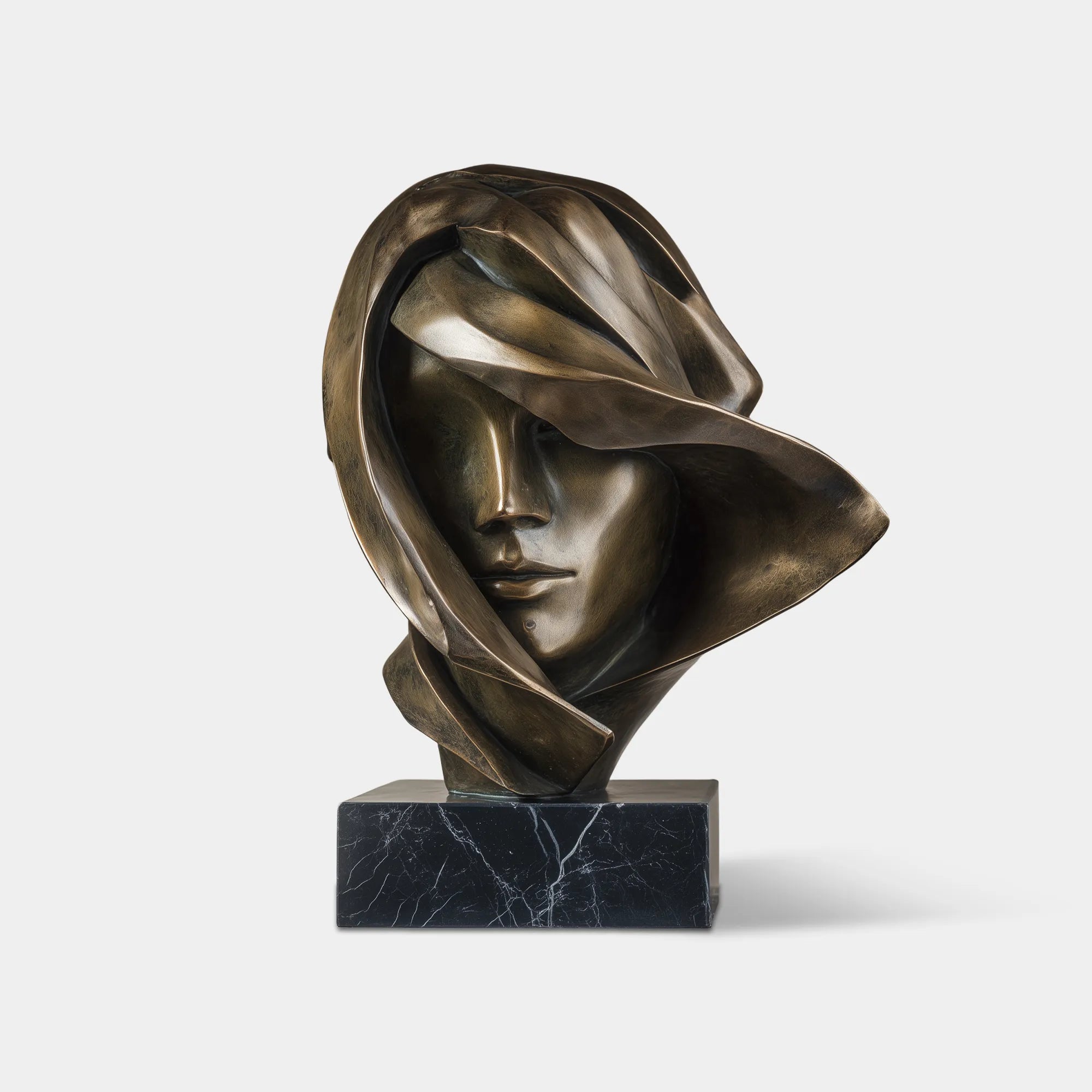 An elegant bronze female bust sculpture rests on a marble shelf with warm backlight and abstract wall art beside it.