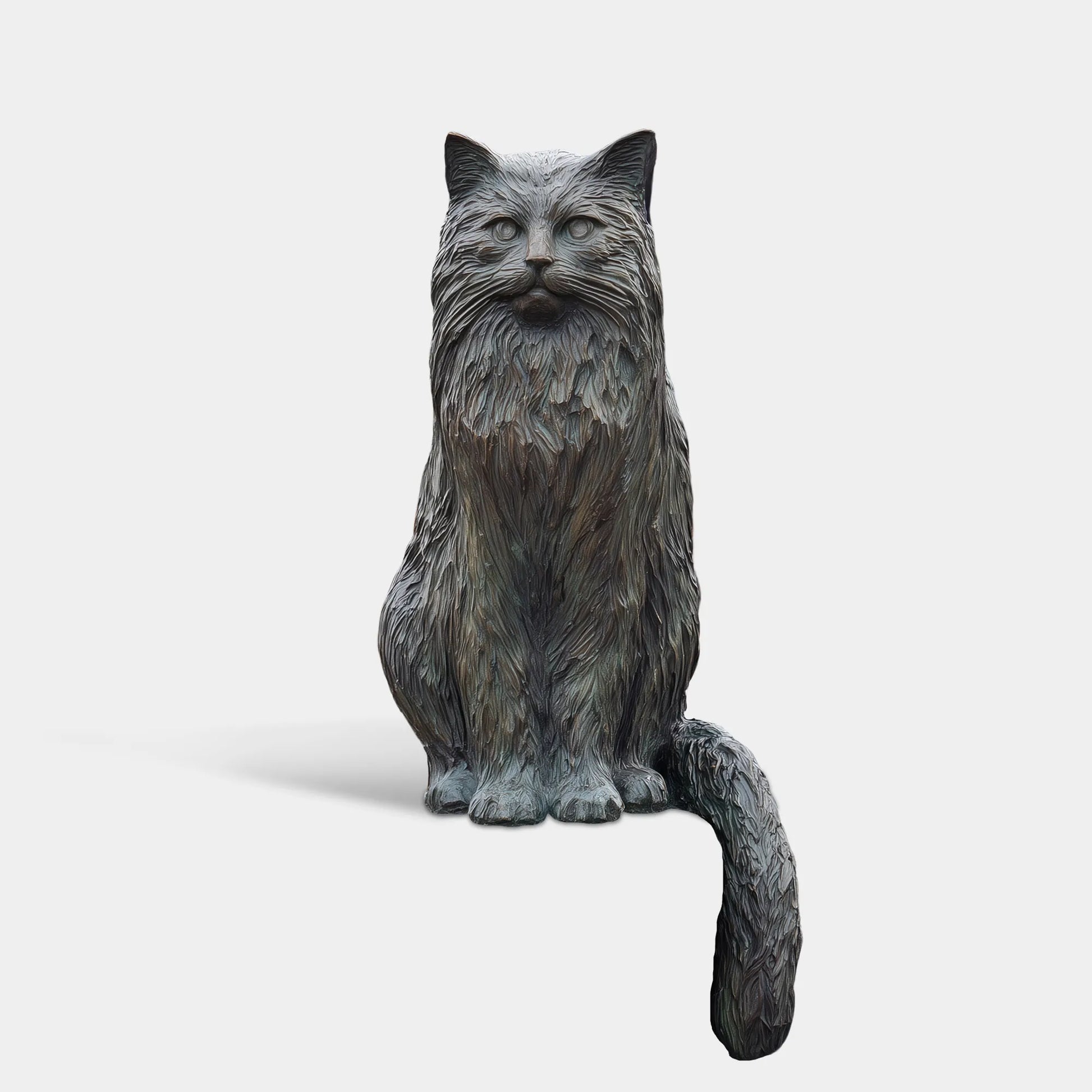 Bronze long haired cat statue sits on porch pillar beside stone steps and black metal fence.