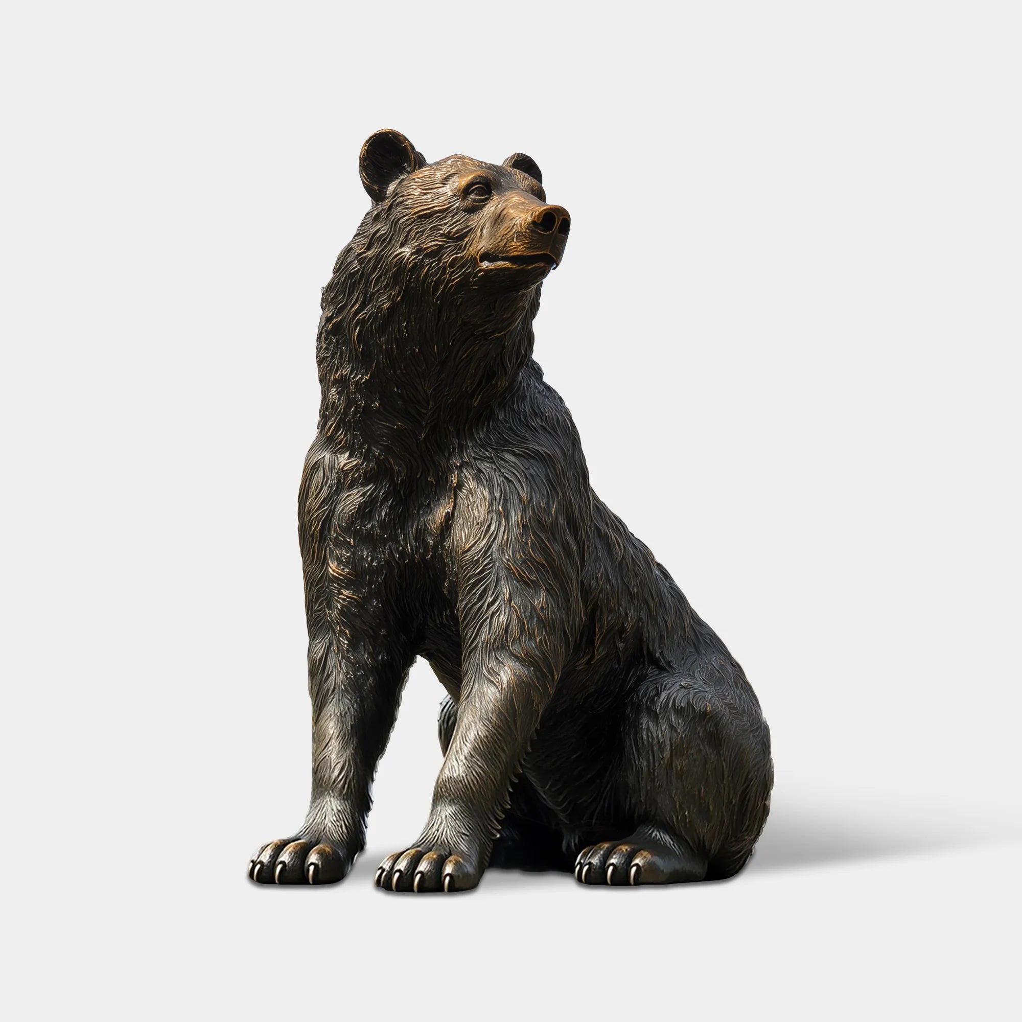 Bronze bear statue standing in an estate entrance.