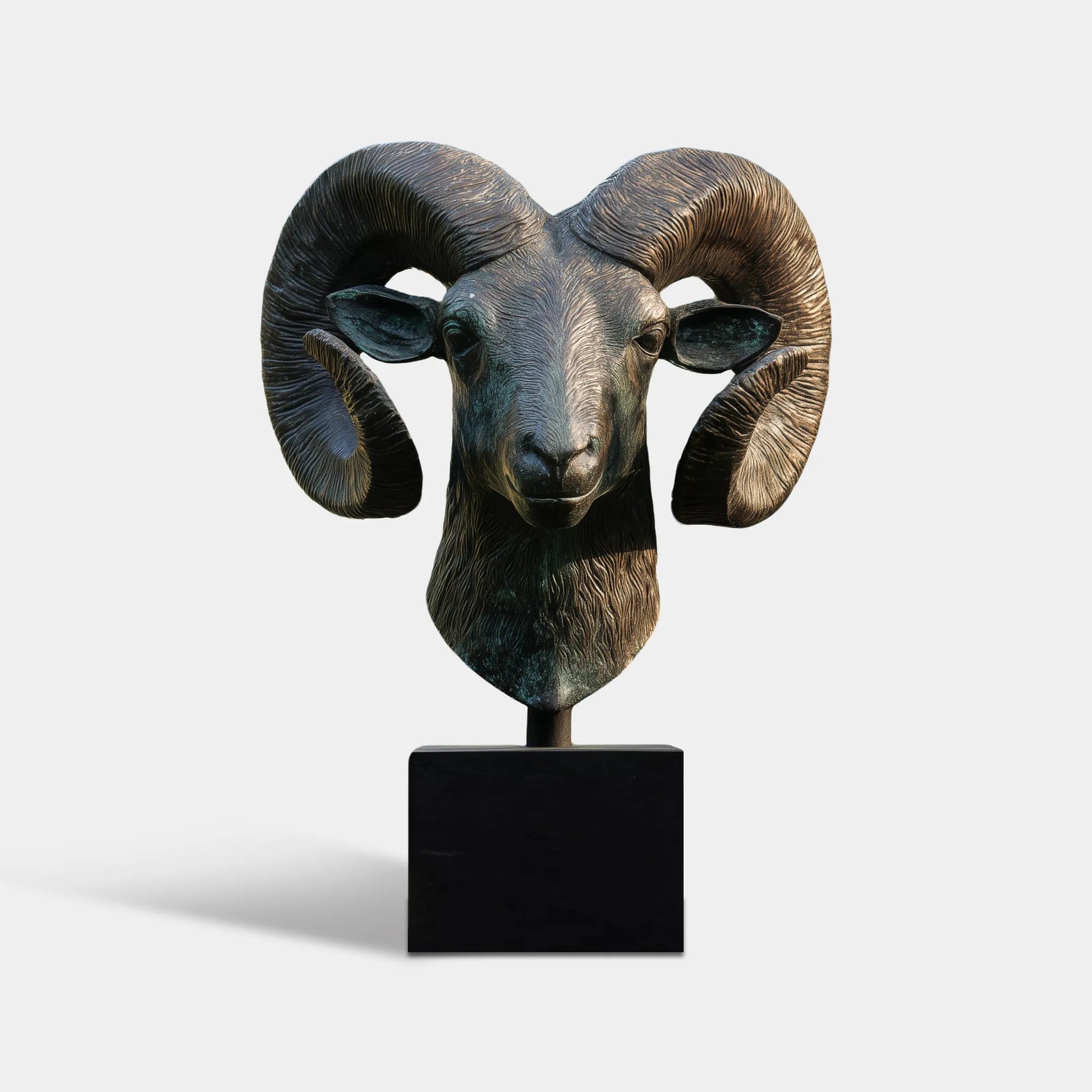 Bronze goat head sculpture with detailed horns and base suitable for estate entrance.