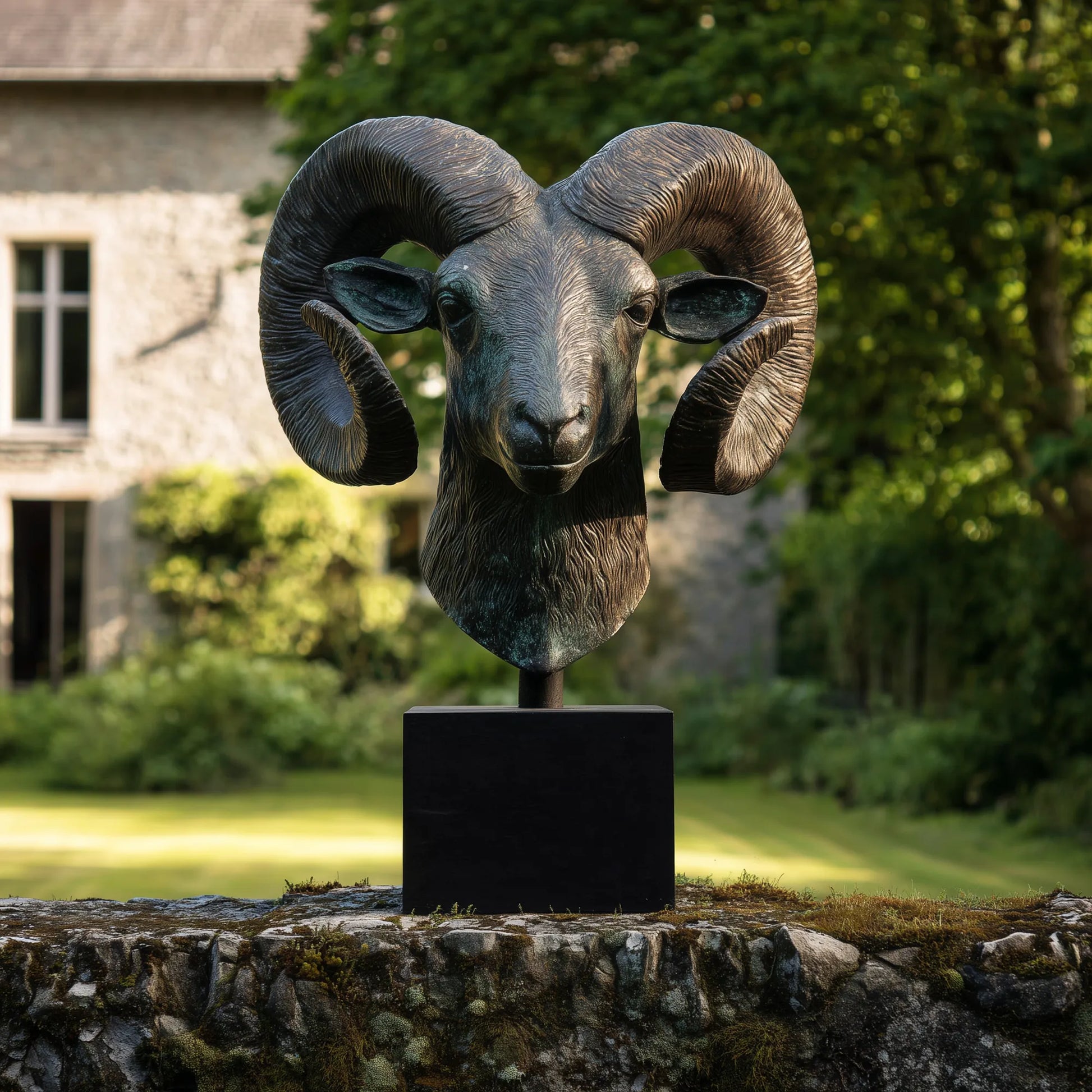 Bronze goat head sculpture with detailed horns and base suitable for estate entrance.