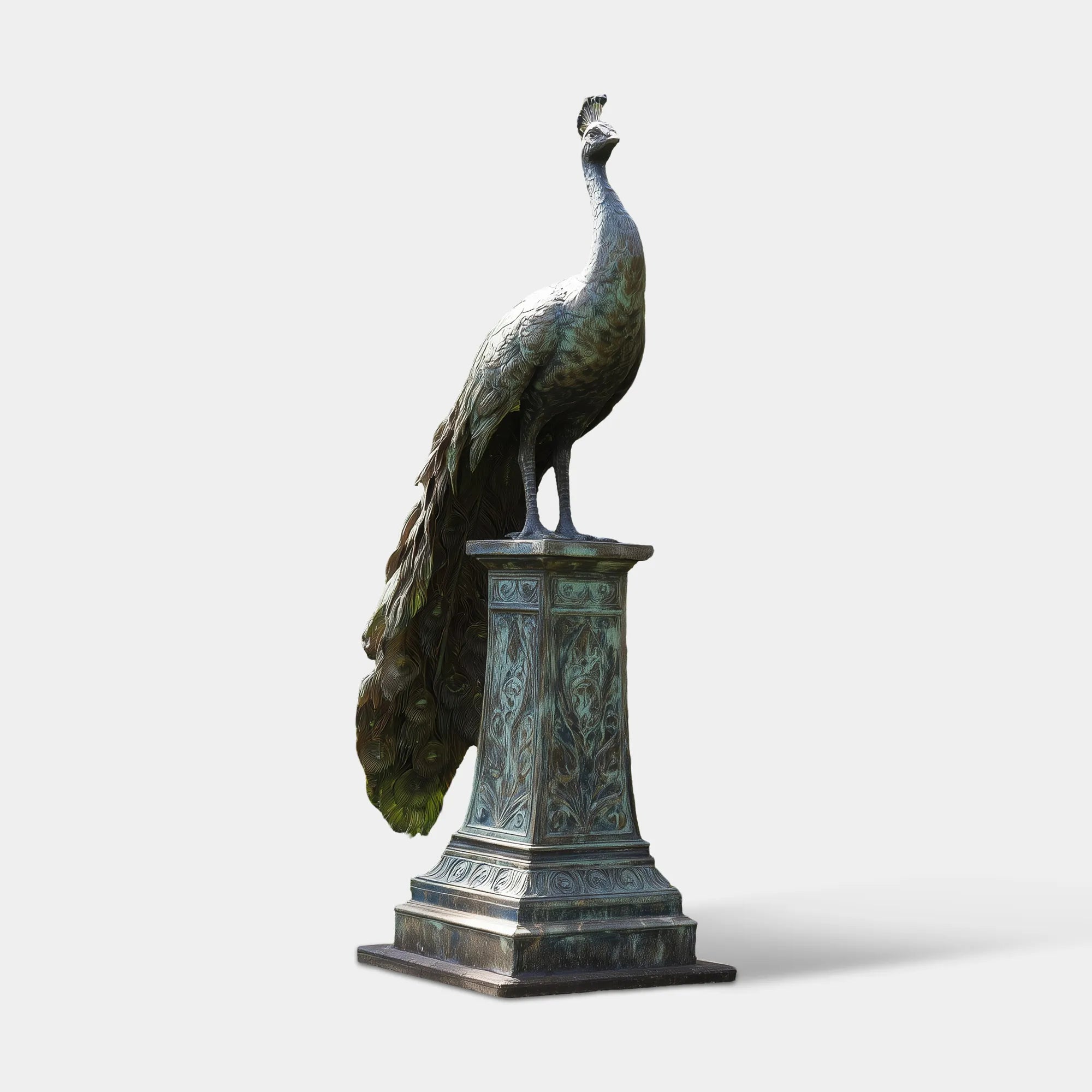 Patina bronze peacock statue stands on a pedestal amid lush garden greenery.