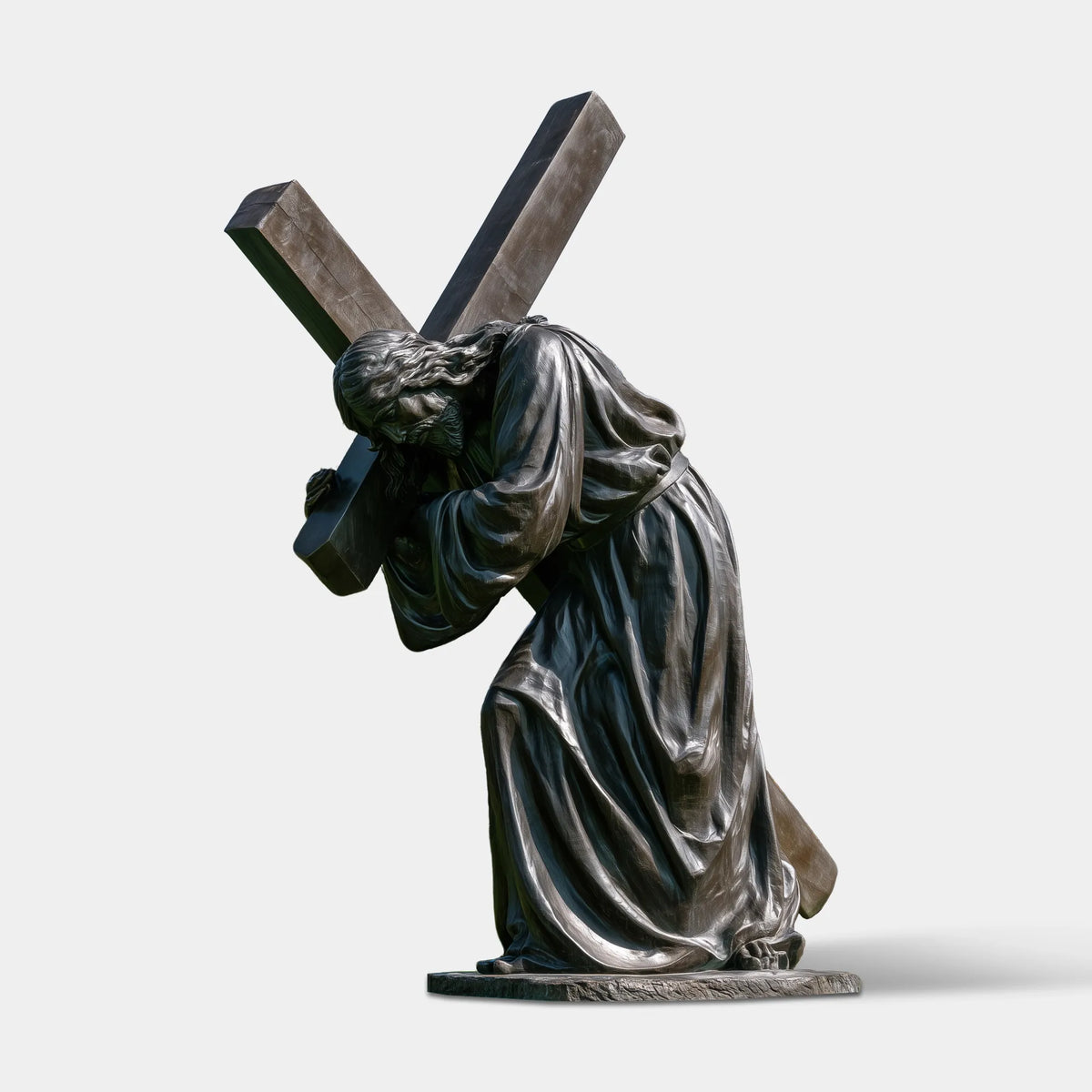 A bronze Jesus statue with a cross stands on the background in front of a church.