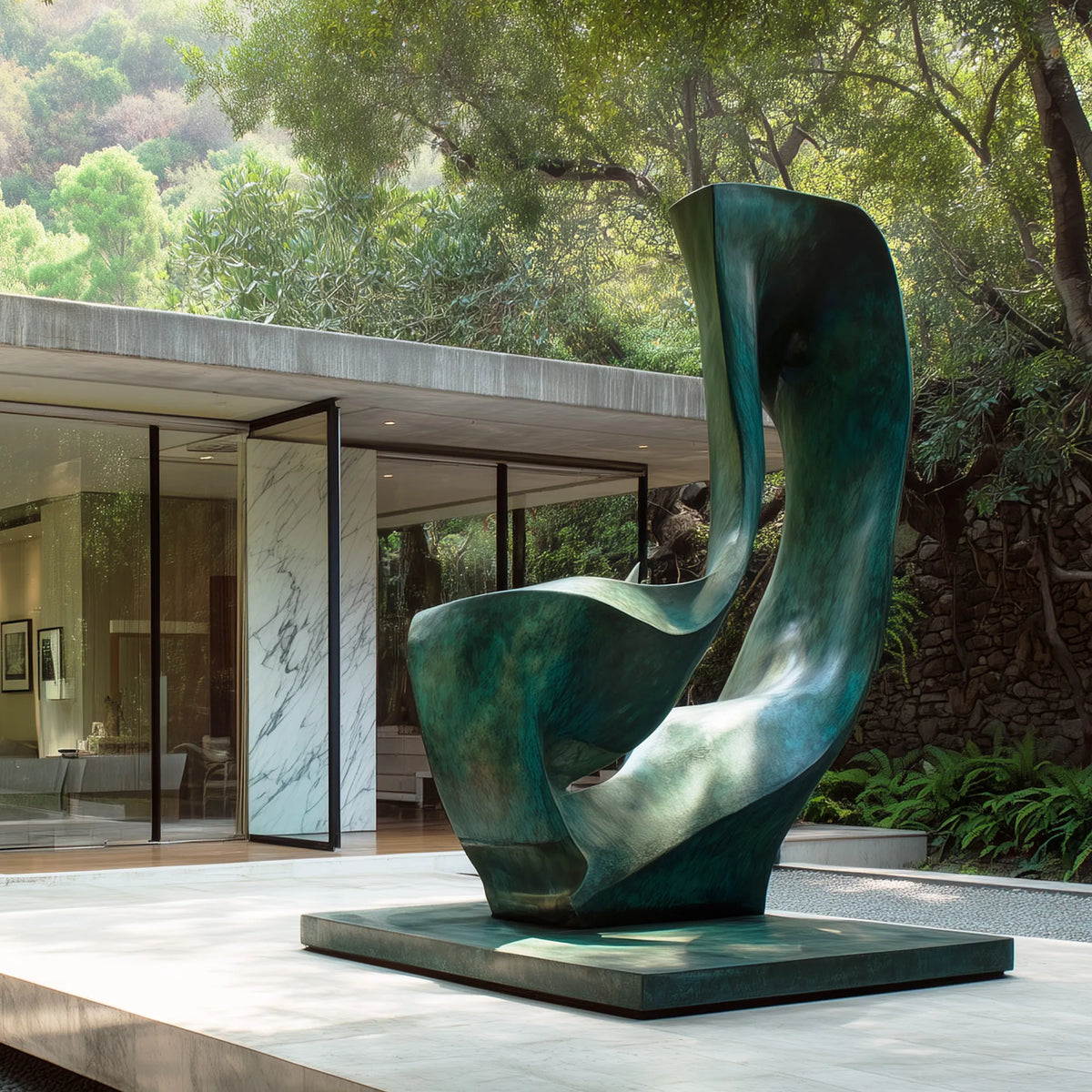 Large bronze abstract sculpture with folded organic forms and a central opening in a modern woodland residence courtyard.