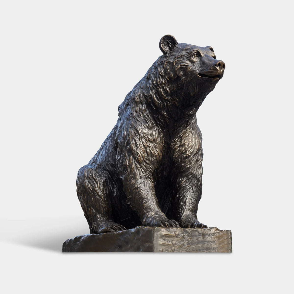 Lifelike seated bear sculpture with detailed fur on a  pedestal in a landscaped park.