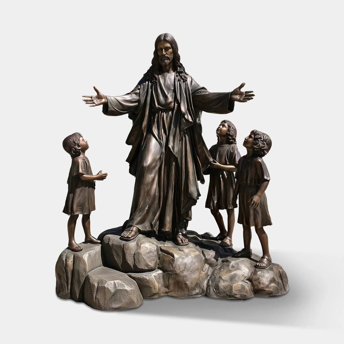A bronze statue of Jesus with three children stands on rock base on the ground before a stone church.